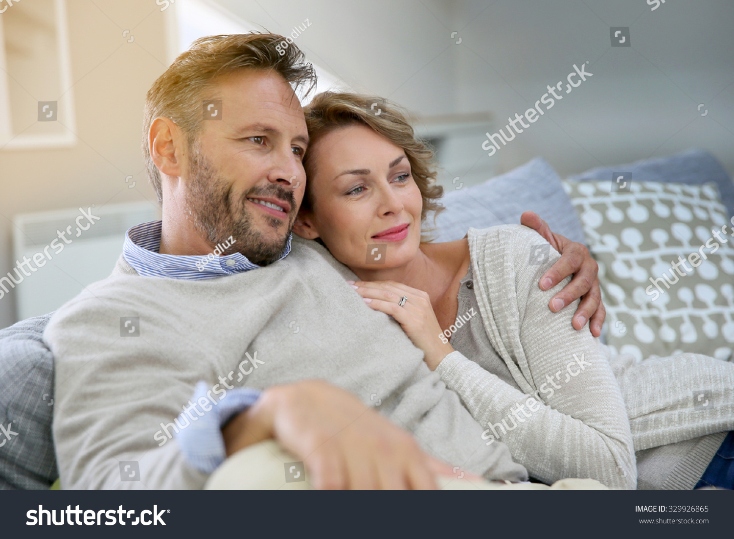 Mature Couple Relaxing In Couch At Home Stock Photo 329926865