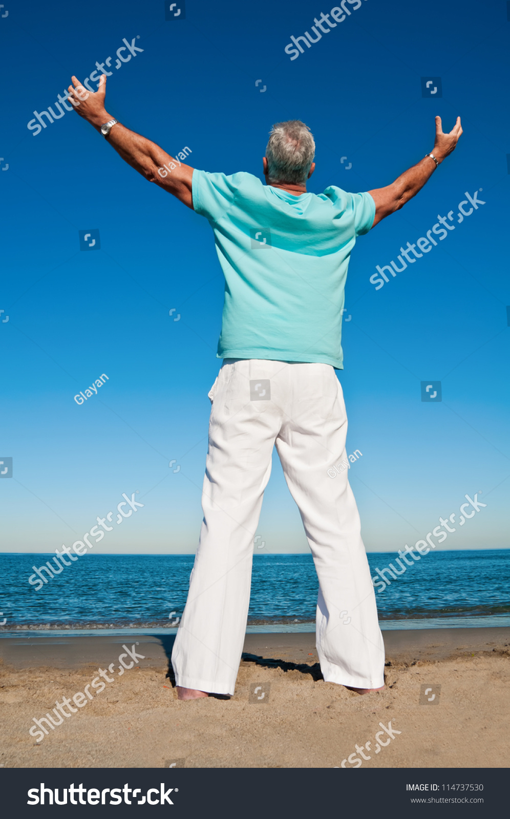 Mature Man With Open Arms At The Beach Praising The Greatness Of A ...