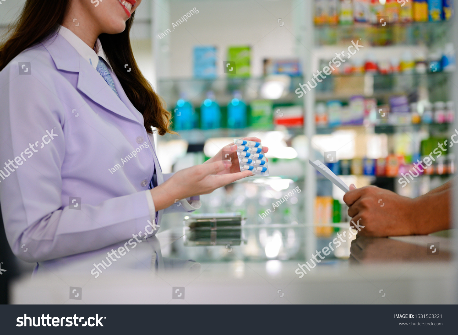 Download Medicine Bundle Hands Selling Pharmacist Offer Stock Photo Edit Now 1531563221