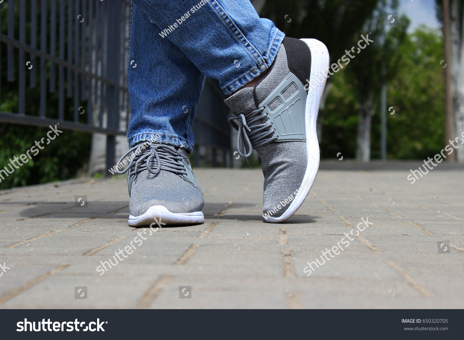 grey sneakers blue jeans