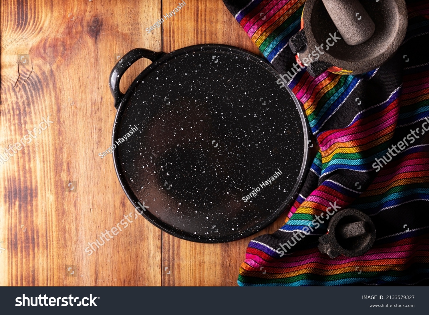 Mexican Kitchen Utensils Colorful Traditional Fabric Stock Photo   Stock Photo Mexican Kitchen Utensils Colorful Traditional Fabric Comal De Peltre And Molcajete On Wooden 2133579327 