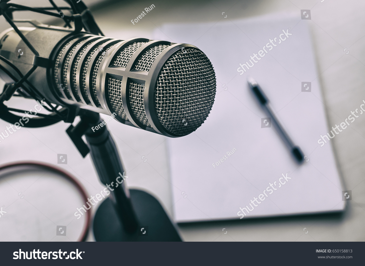 stock-photo-microphone-sheets-of-paper-and-pen-650158813.jpg