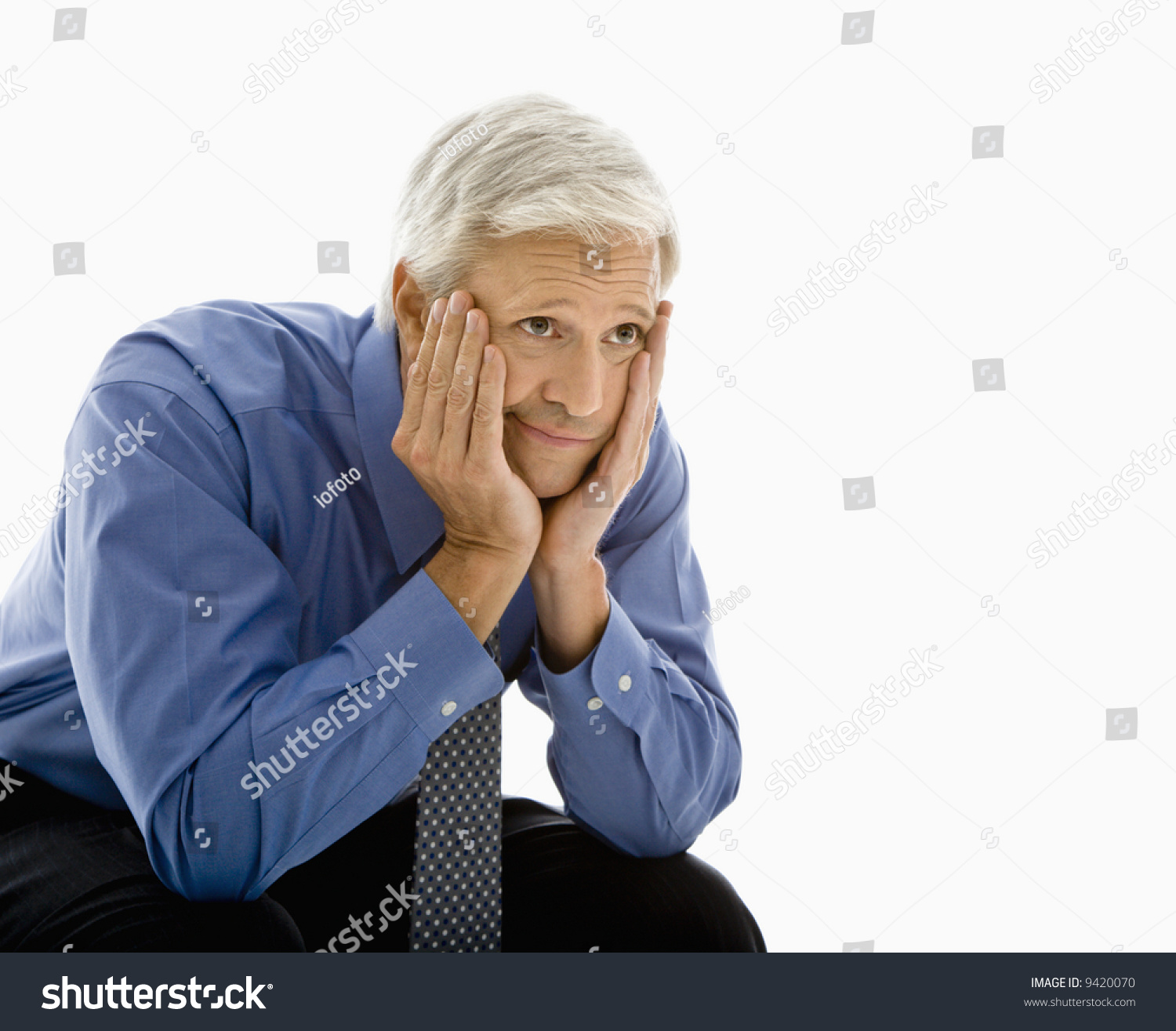 Middle Aged Caucasian Man With Head Resting In Hands Looking Bored ...