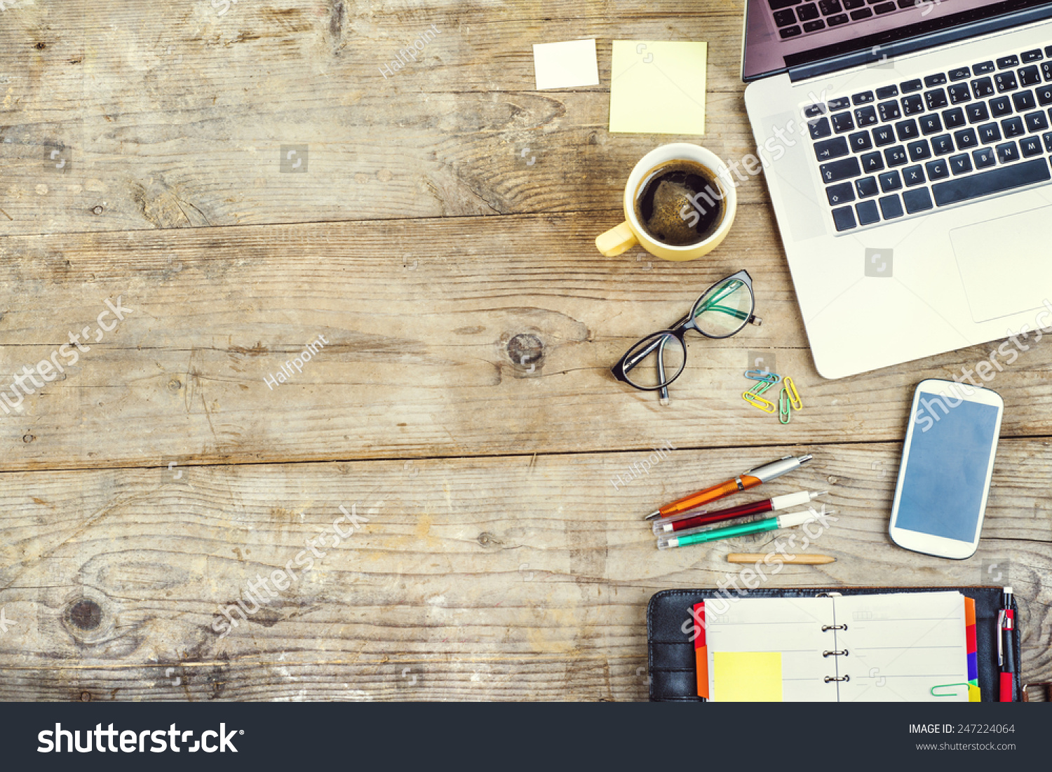 stock photo mix of office supplies and gadgets on a wooden table background view from above 247224064