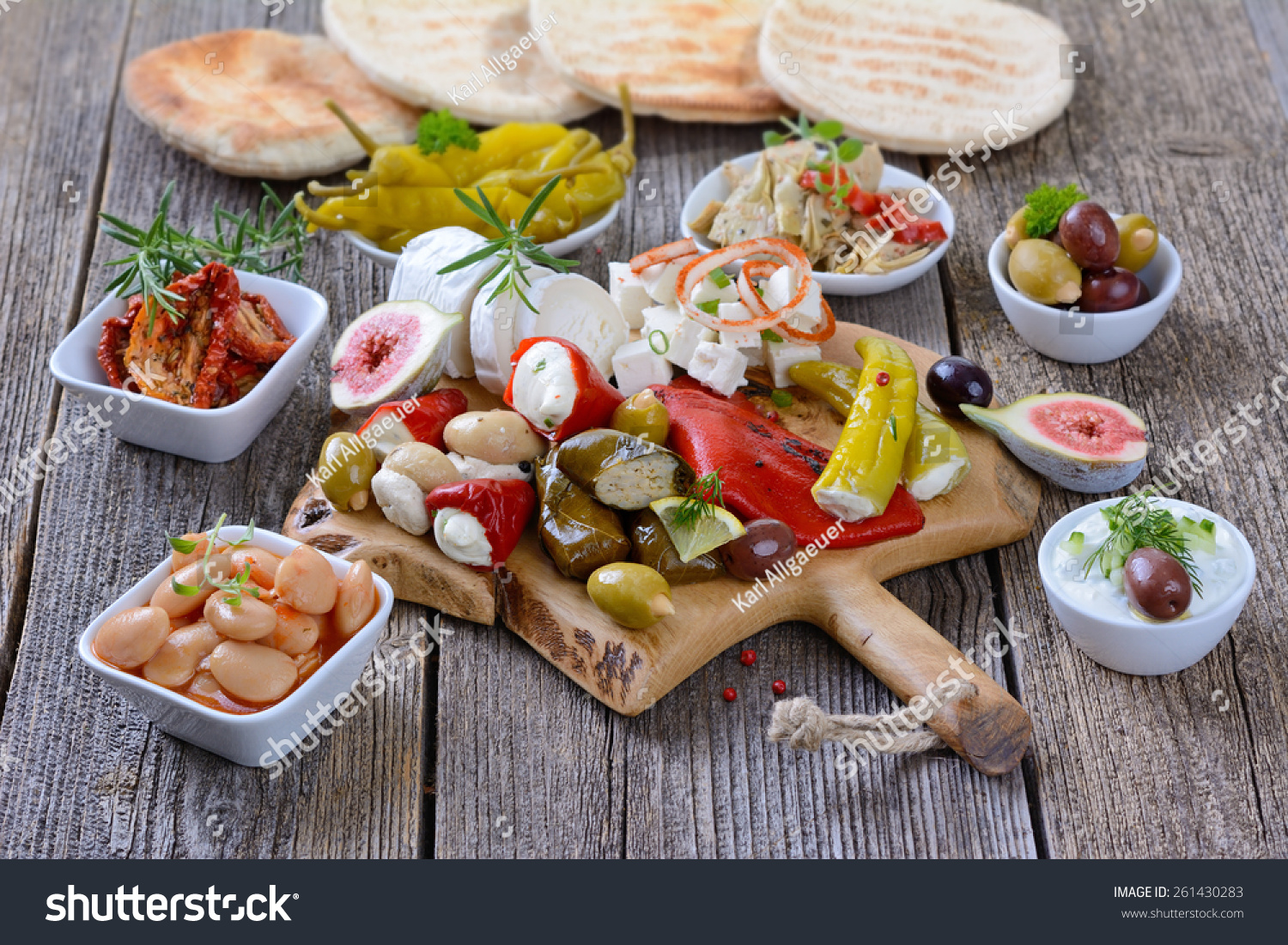 Mixed Greek Antipasti On A Wooden Cutting Board Stock Photo 261430283 ...