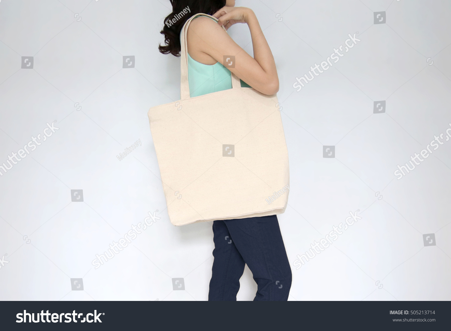 Download Mockup Girl Holding Blank Canvas Tote Stock Photo ...