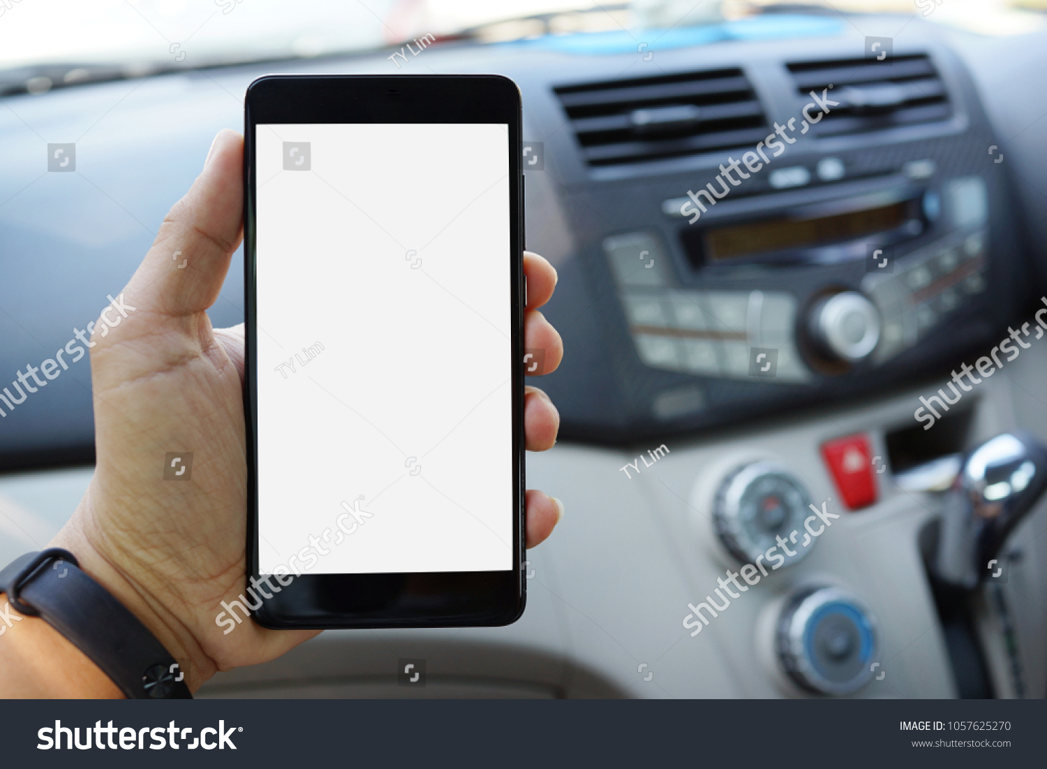 Download Mockup Phone Hand On Blurred Car Stock Photo Edit Now 1057625270 PSD Mockup Templates