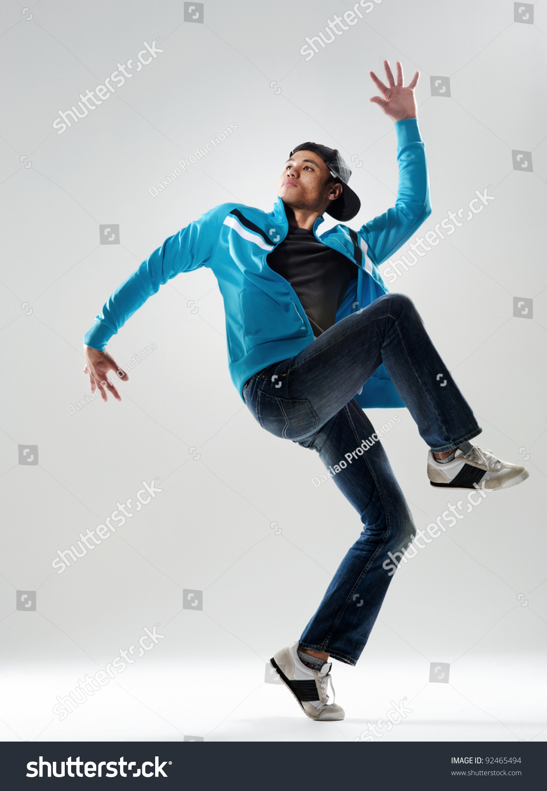 Modern Hip Hop Dancer Lifts His Leg And Does Some Moves While Dressed ...