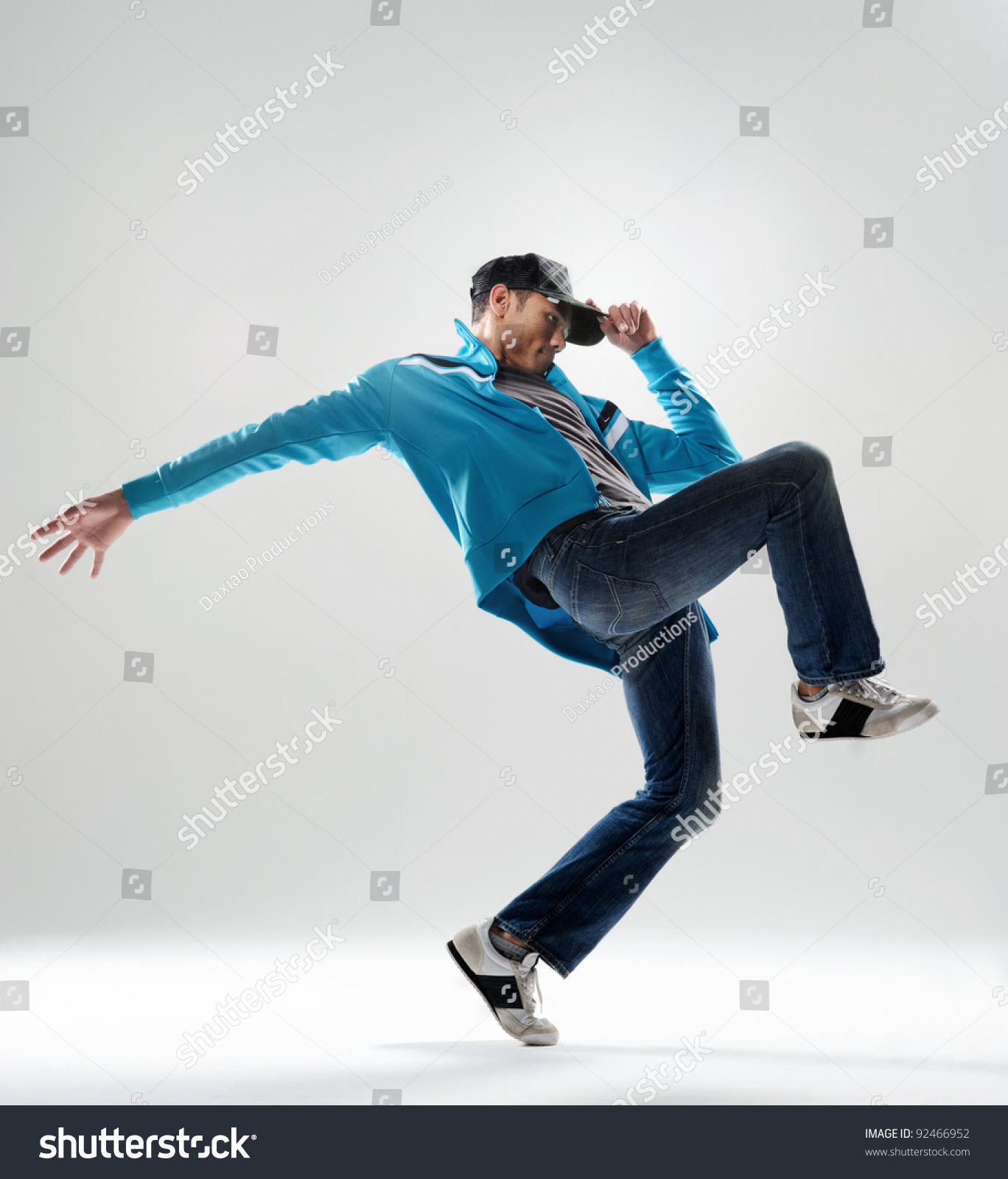 Modern Hip Hop Dancer Lifts His Leg And Does Some Moves While Dressed ...