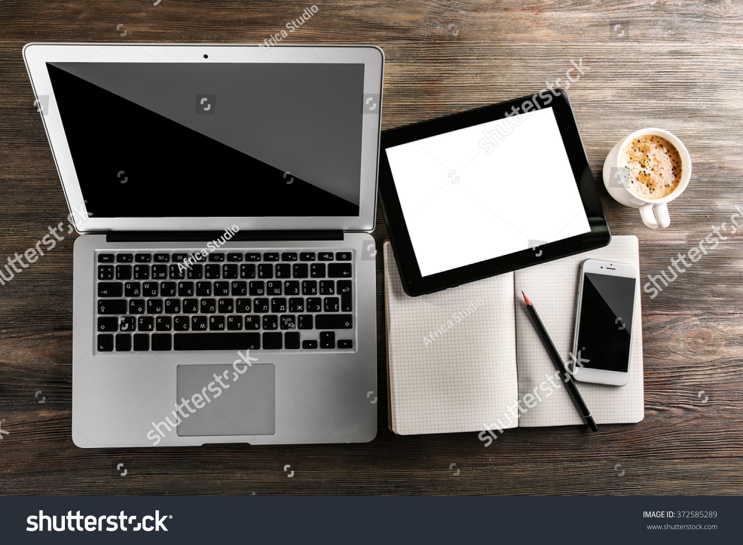 Modern Laptop, Mobile Phone, Tablet, Notebook And Coffee Cup On Wooden ...