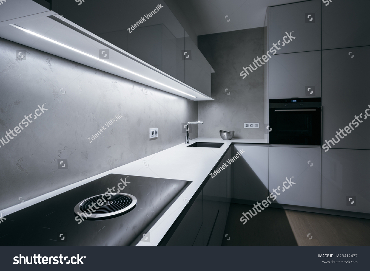 1 295 Hob Extractor Images Stock Photos Vectors Shutterstock   Stock Photo Modern Minimal Kitchen With White Worktop Bright Light Strip Turned On And Modern Appliances 1823412437 