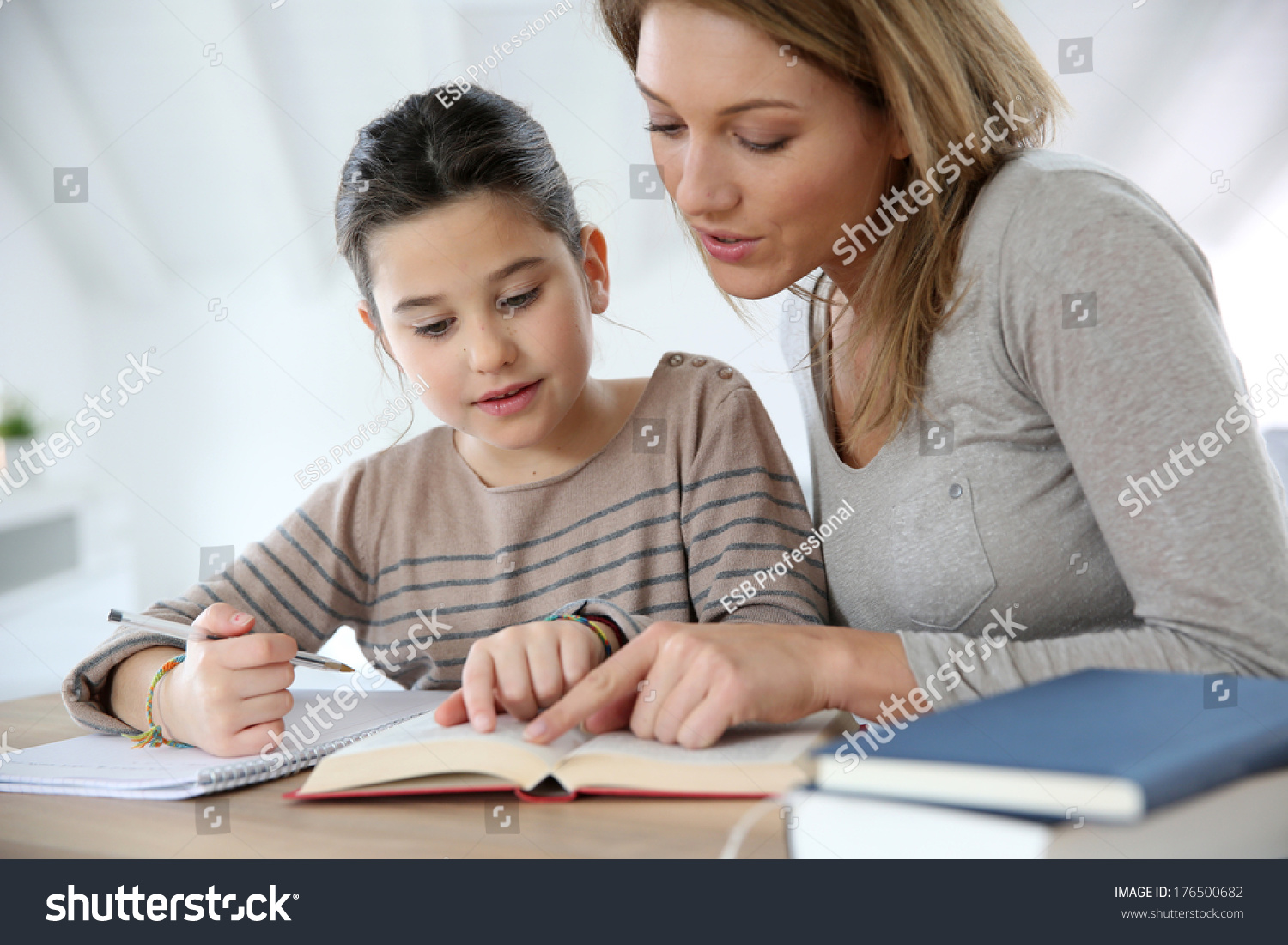 mom helping kid with homework