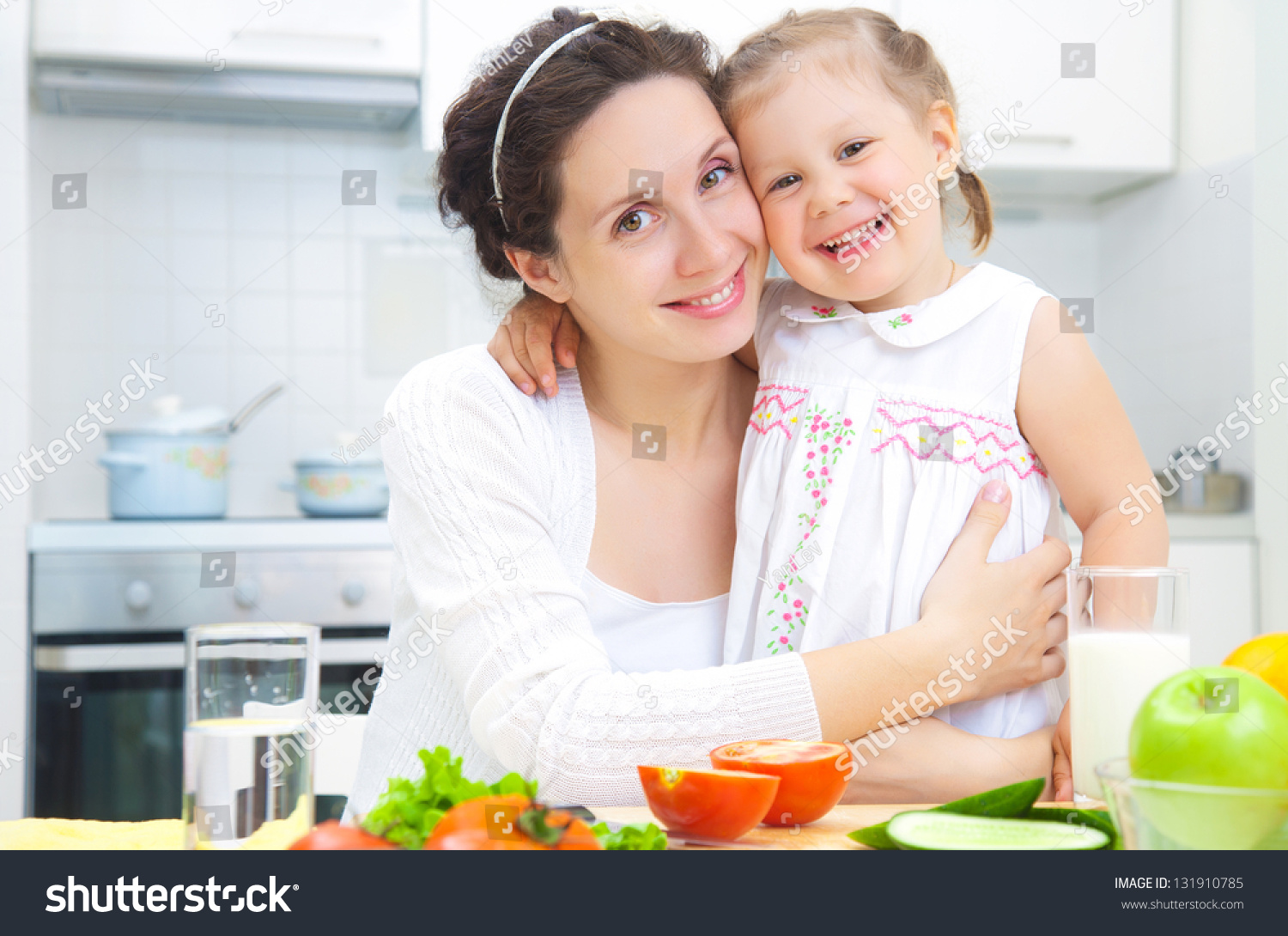 Mother And Daughter Cooking Dinner In Kitchen Stock Photo 131910785 ...