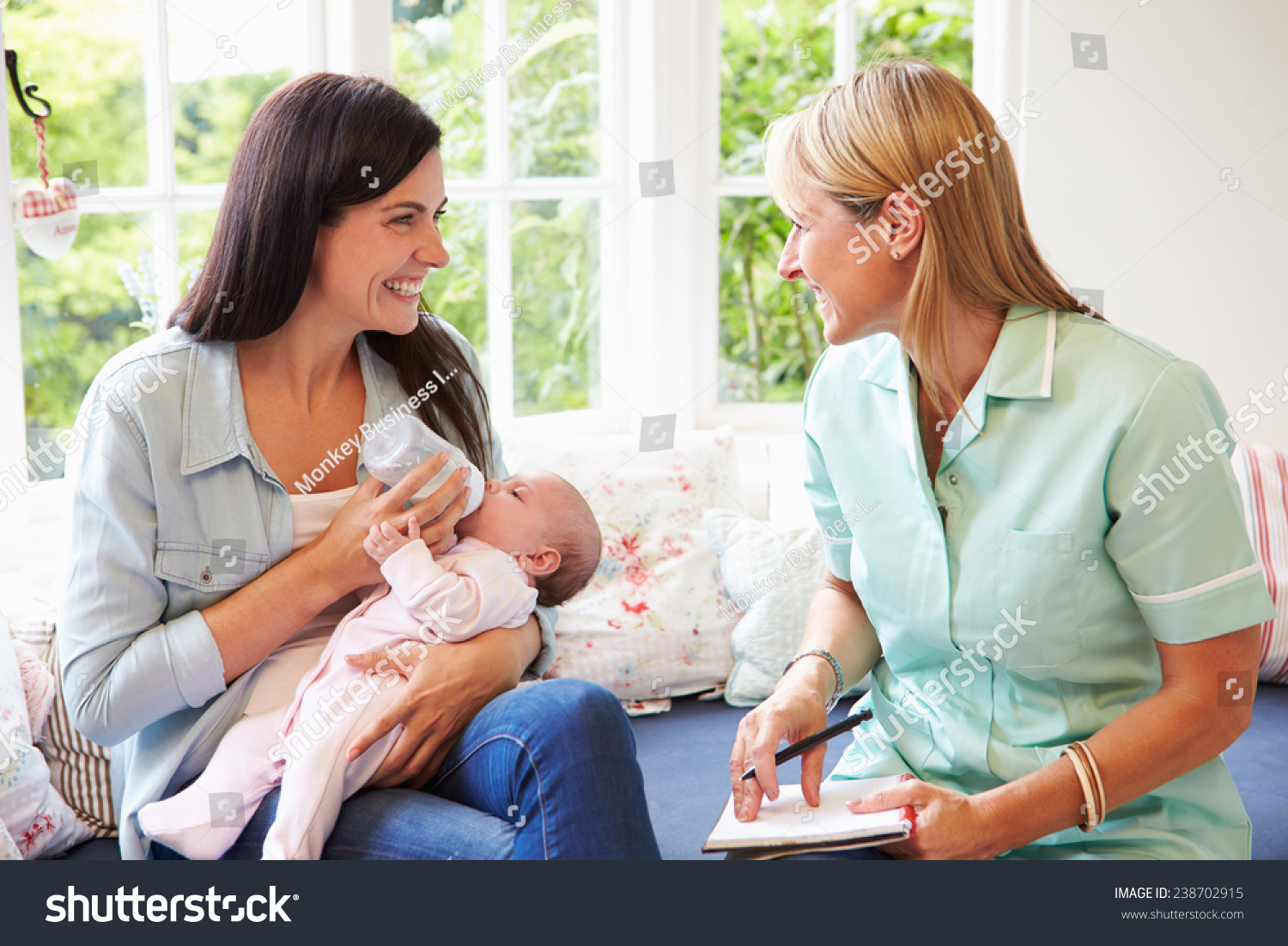 Mother Baby Meeting Health Visitor Home Stock Photo Edit Now