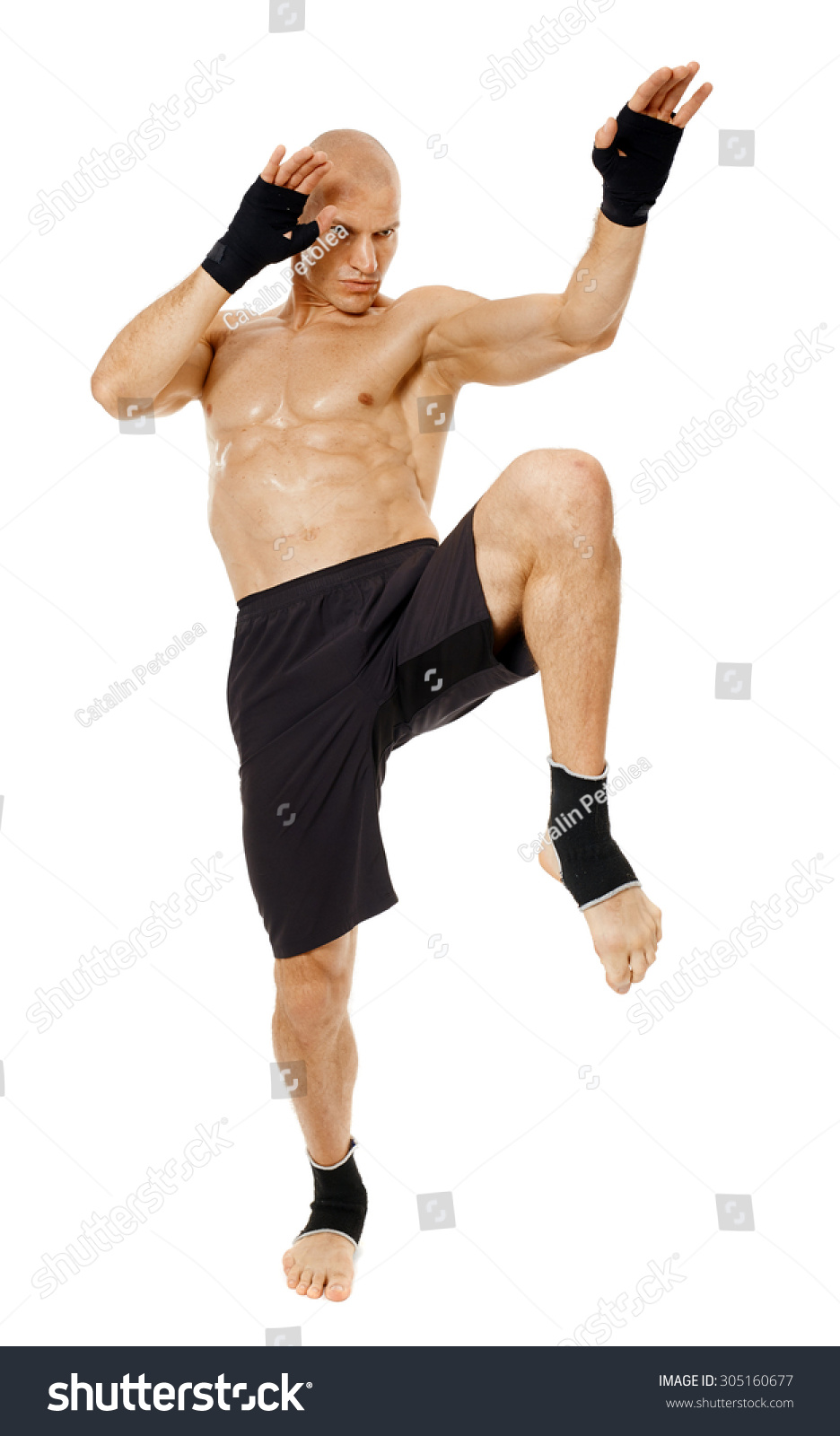 Muay Thai Fighter Delivering A Knee Blow, Isolated On White Background ...