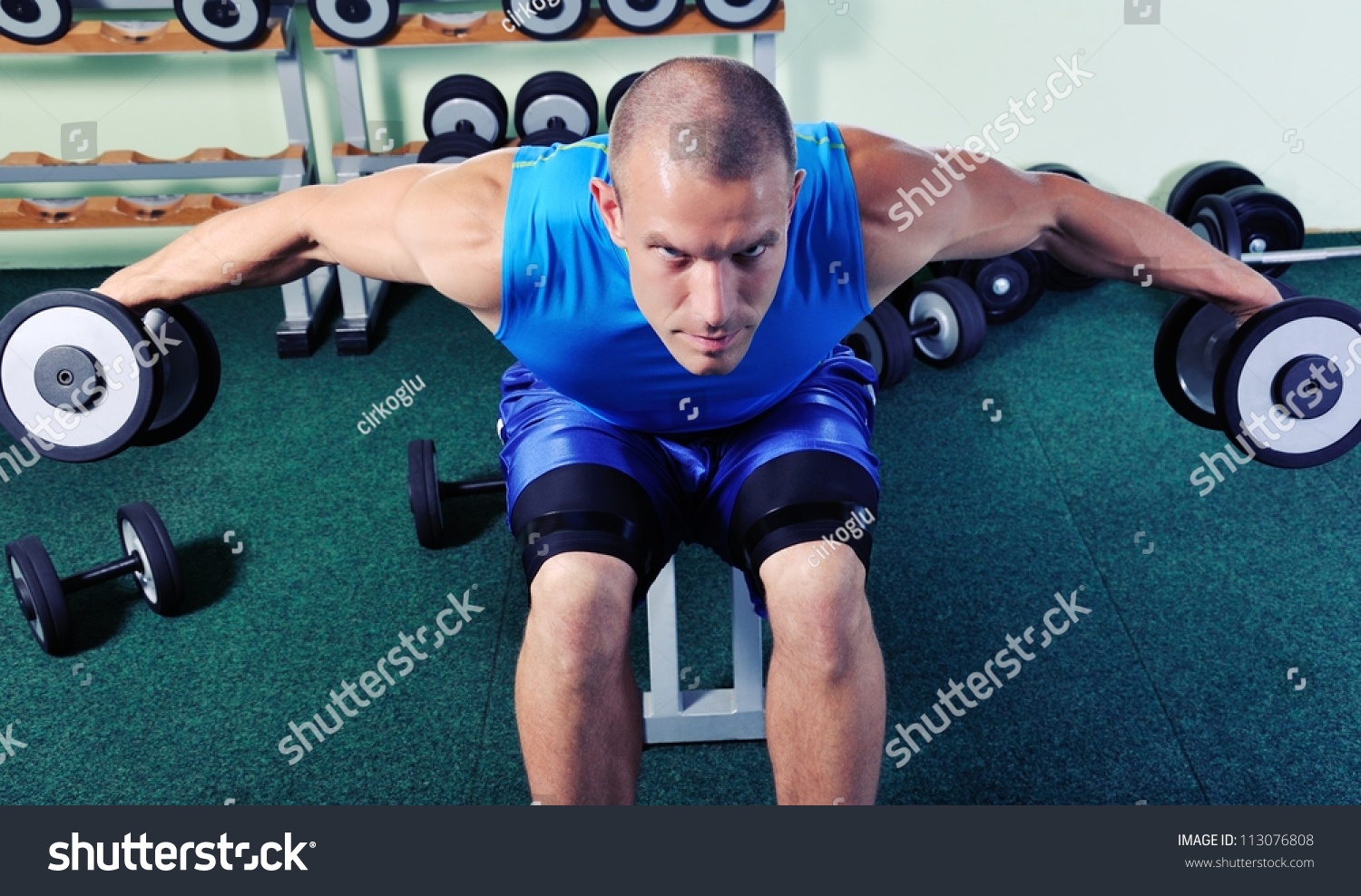 Muscular Man Exercising In A Gym Stock Photo 113076808 : Shutterstock