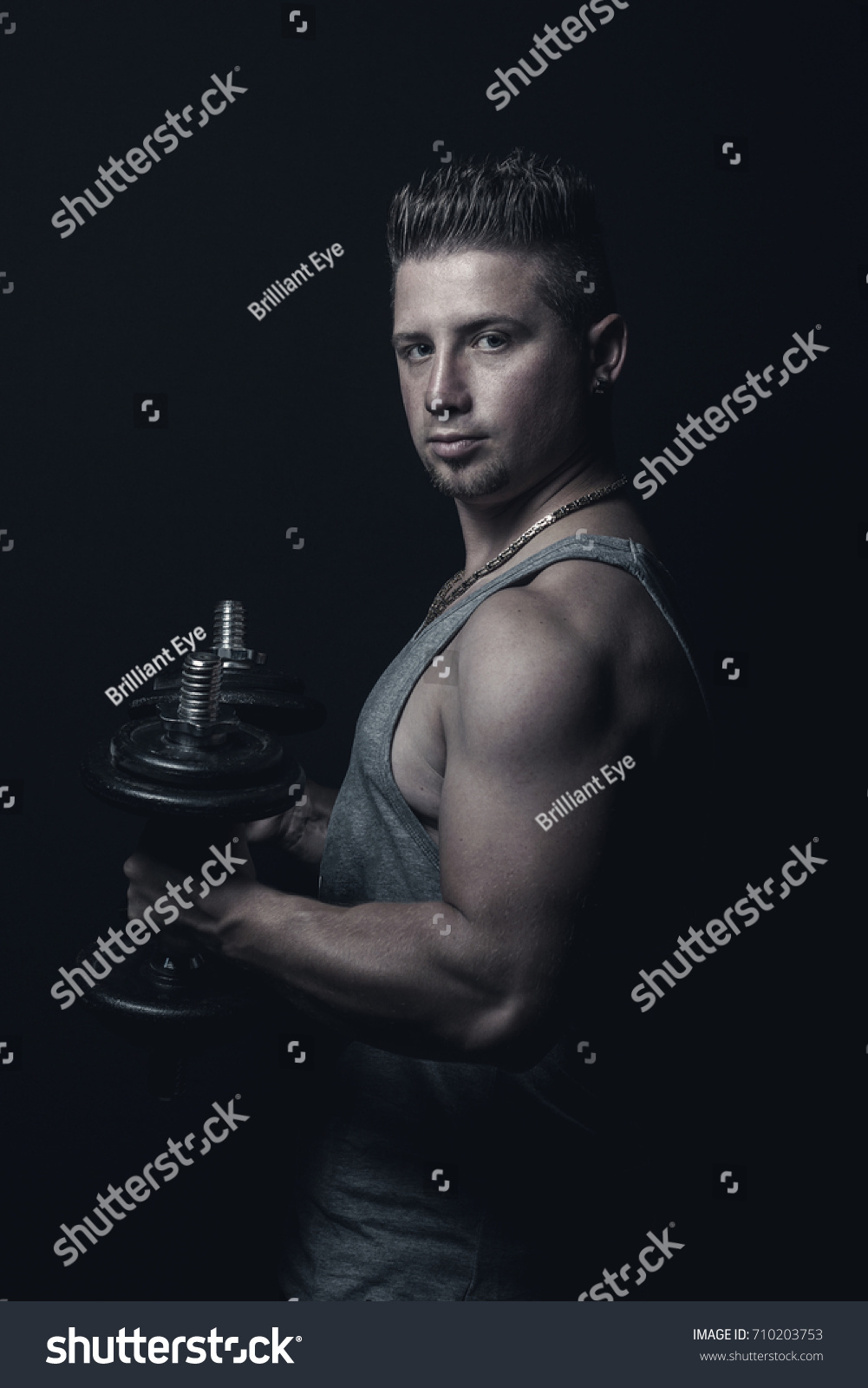 Muscular Young Man Flexing Biceps Dumbbells Stock Photo 710203753 ...