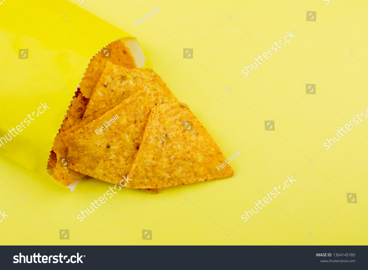 Download Nachos Chips On Yellow Paper Background Stock Photo Edit Now 1364145785 PSD Mockup Templates