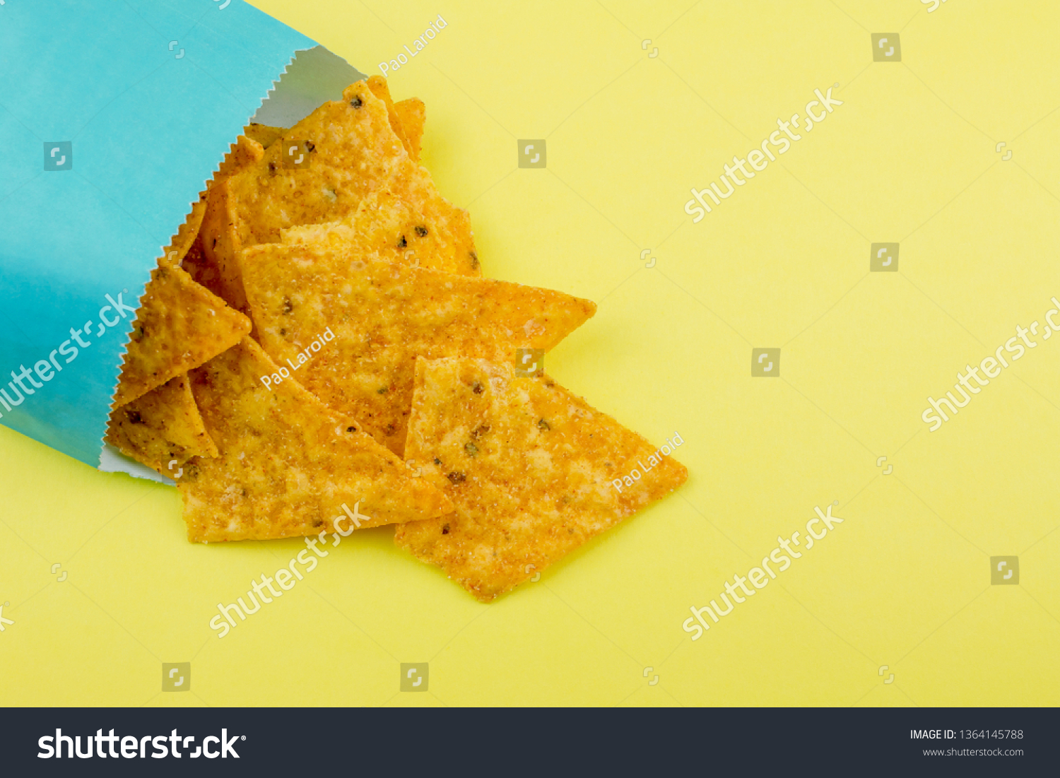 Download Nachos Chips On Yellow Paper Background Education Stock Image 1364145788 PSD Mockup Templates