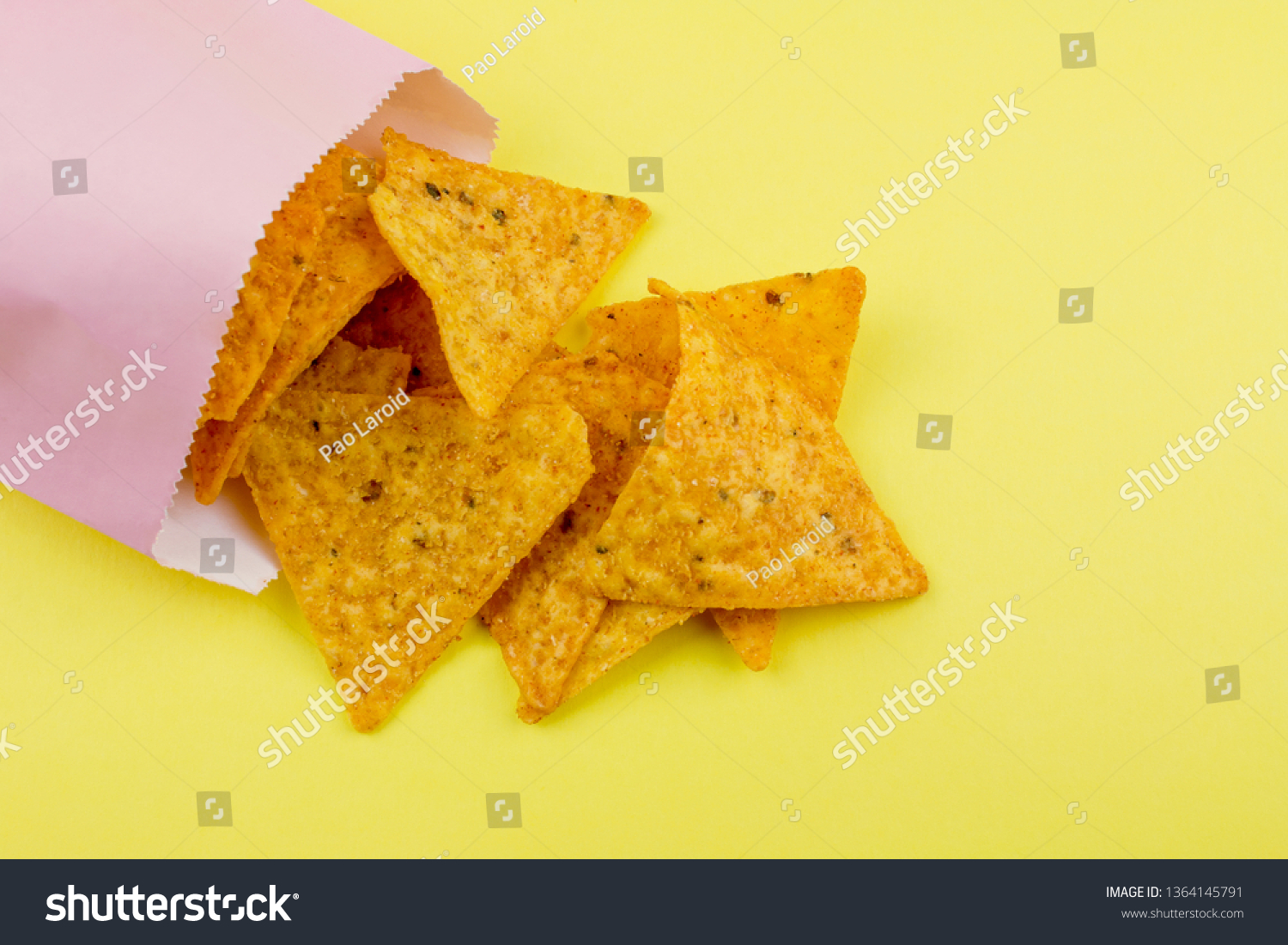 Download Nachos Chips On Yellow Paper Background Stock Photo Edit Now 1364145791 PSD Mockup Templates