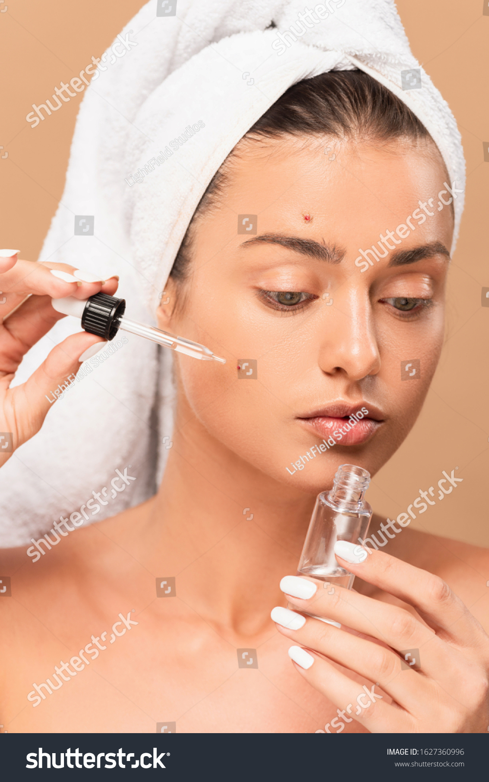 Naked Woman Applying Serum On Face Stock Photo Shutterstock