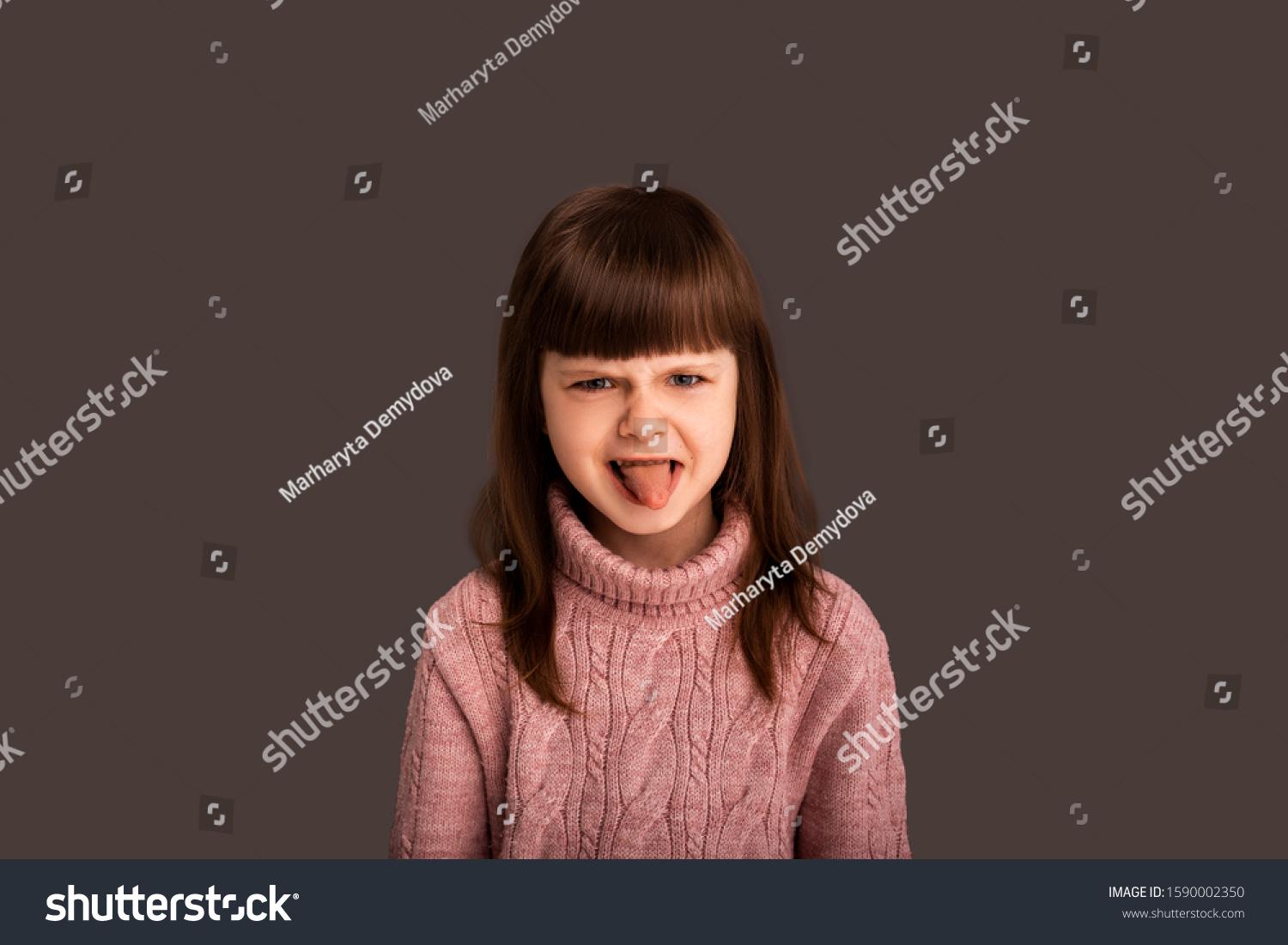 naughty-little-girl-child-shows-tongue-stock-photo-1590002350