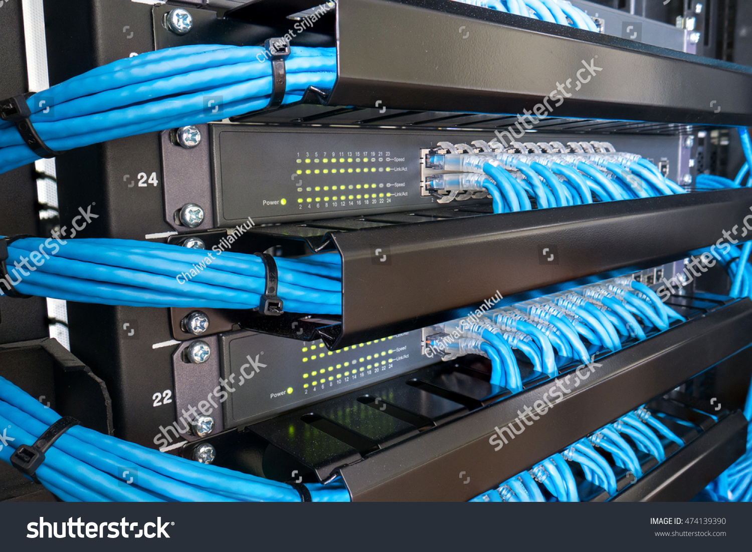 Network Switch And Ethernet Cables In Rack Cabinet