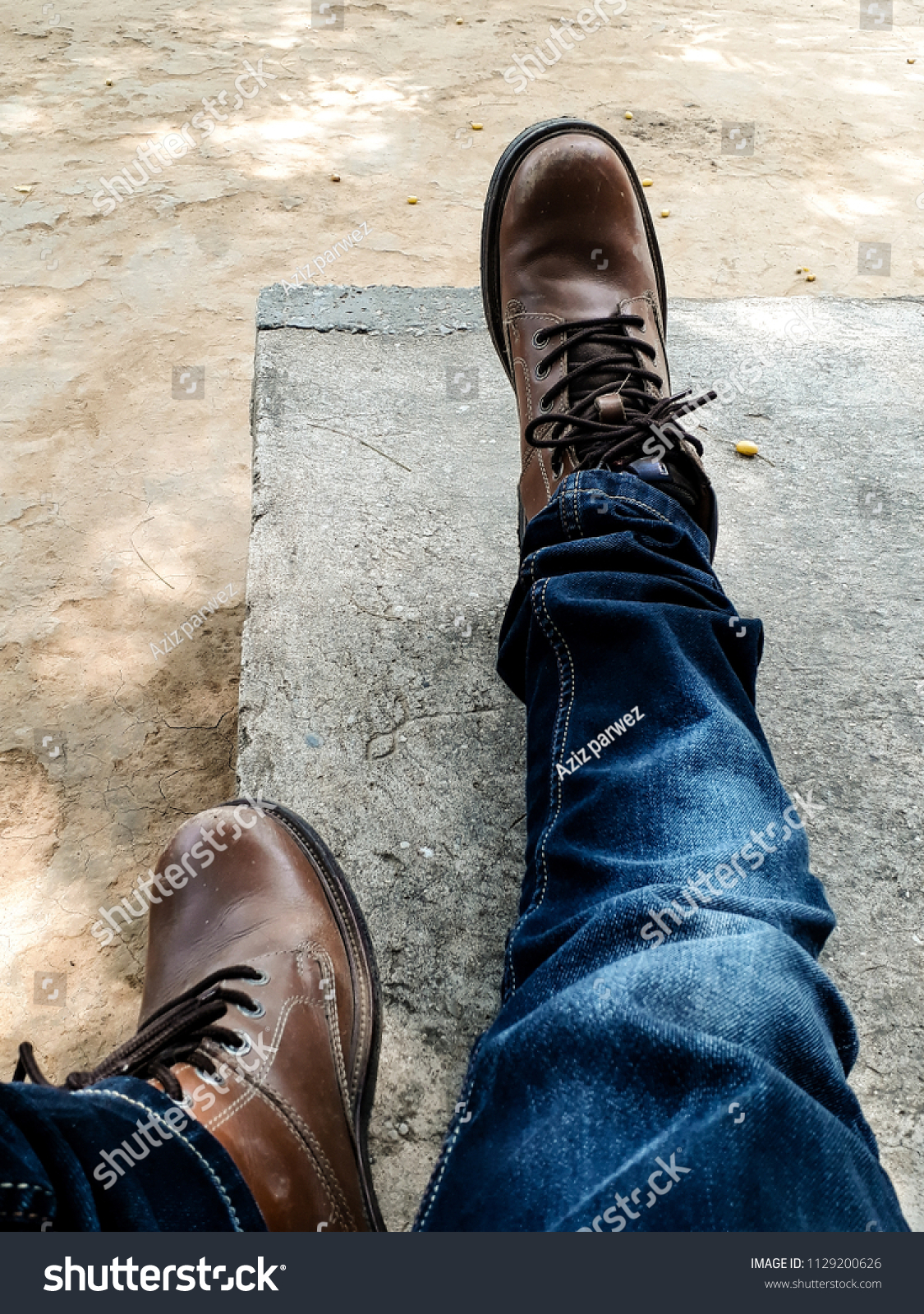 brown shoes with light blue jeans