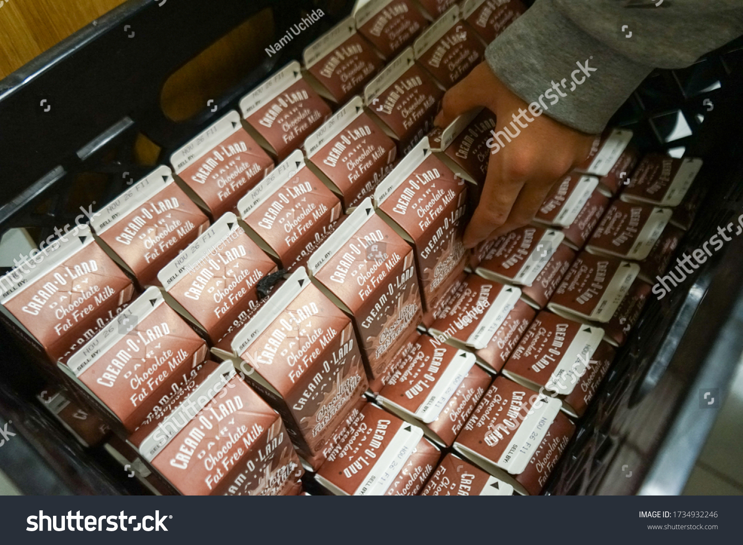 235 School Milk Carton Images Stock Photos Vectors Shutterstock   Stock Photo New York City New York Usa May A Hand Reaching For A Cream O Land Chocolate Milk 1734932246 