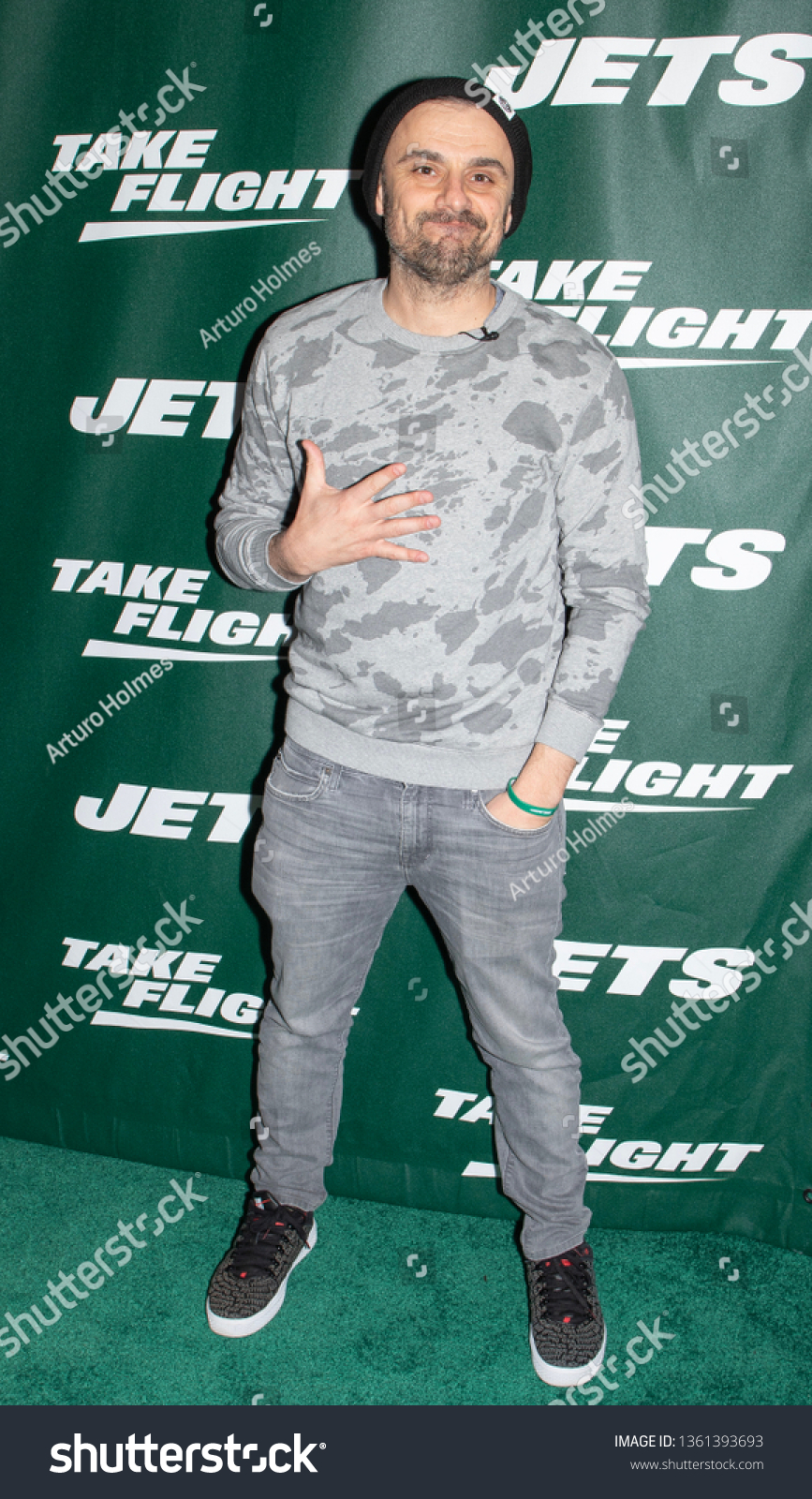 New York Jets fans A.J. (L) and Gary Vaynerchuk await their team's pick  during the first round of the NFL Draft on April 30, 2015 in Chicago. The  Jets selected USC's Leonard