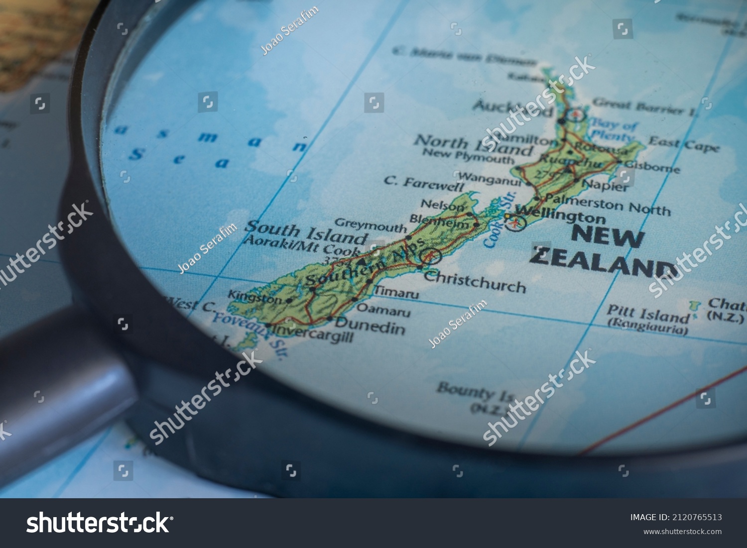 New Zealand On World Map Through Stock Photo Edit Now 2120765513 Stock Photo New Zealand On A World Map Through Magnifying Glass New Zealand Travel Destination Planning Pinned 2120765513