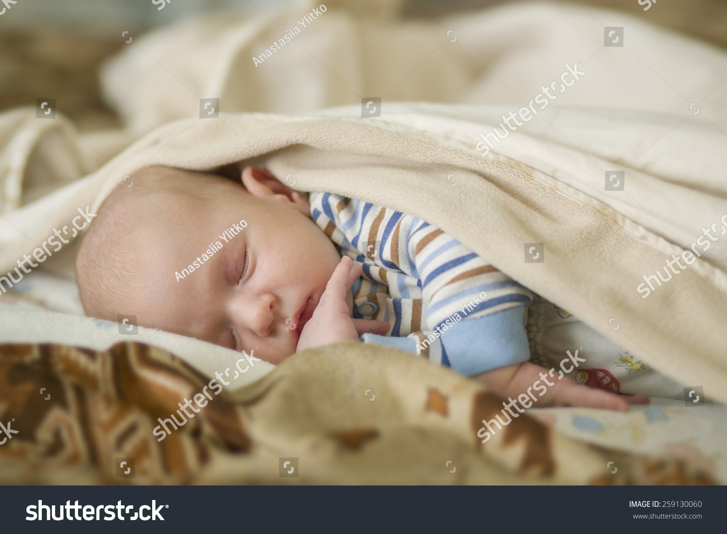 newborn-baby-sleeps-crib-stock-photo-259130060-shutterstock