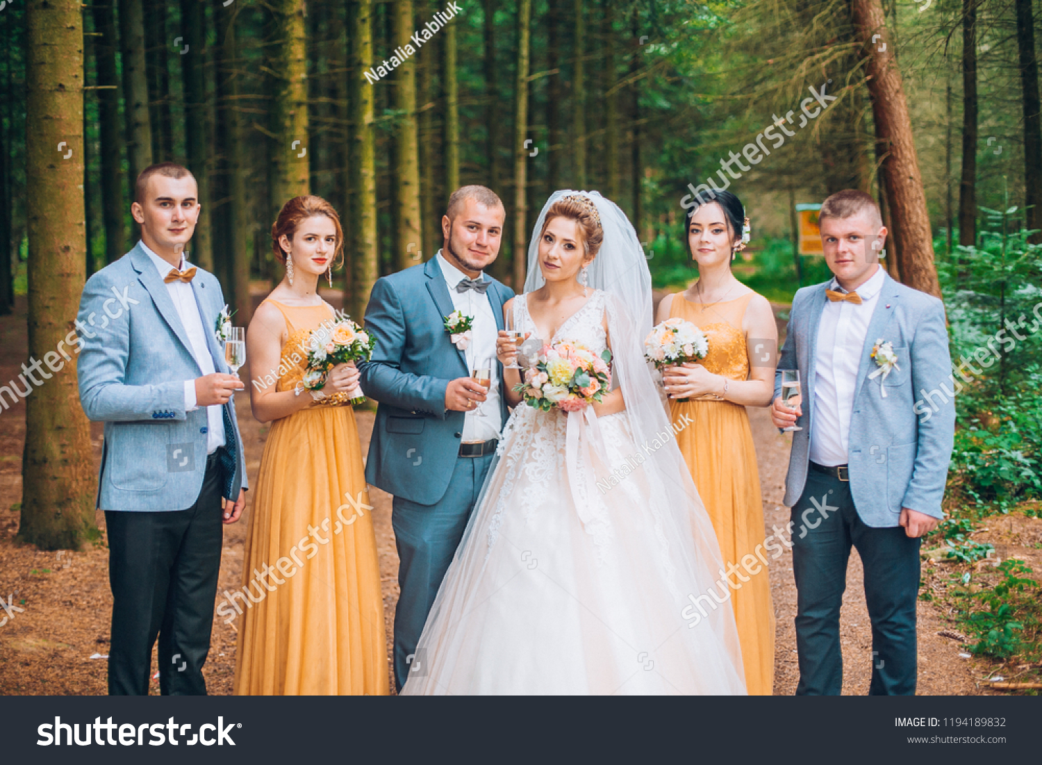 Newly Married Couple Groomsmen Bridesmaids Posing Stock Photo