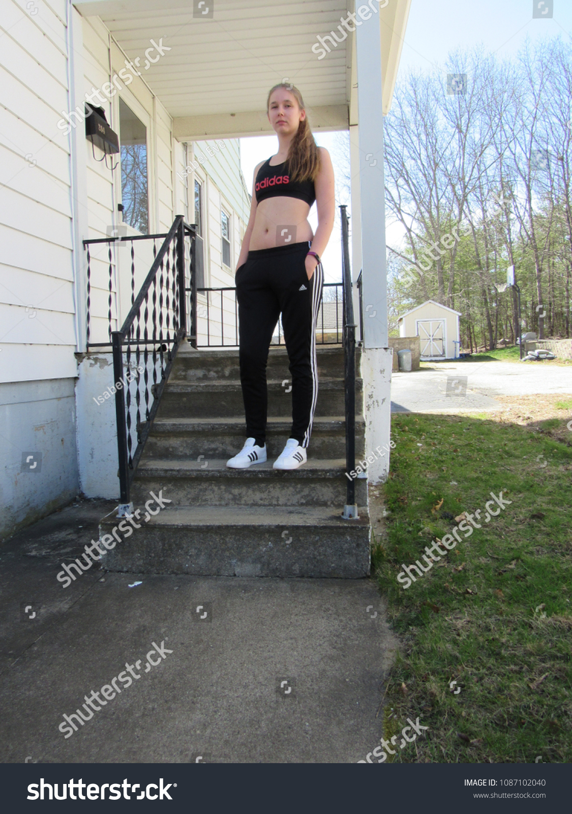 girl wearing adidas pants