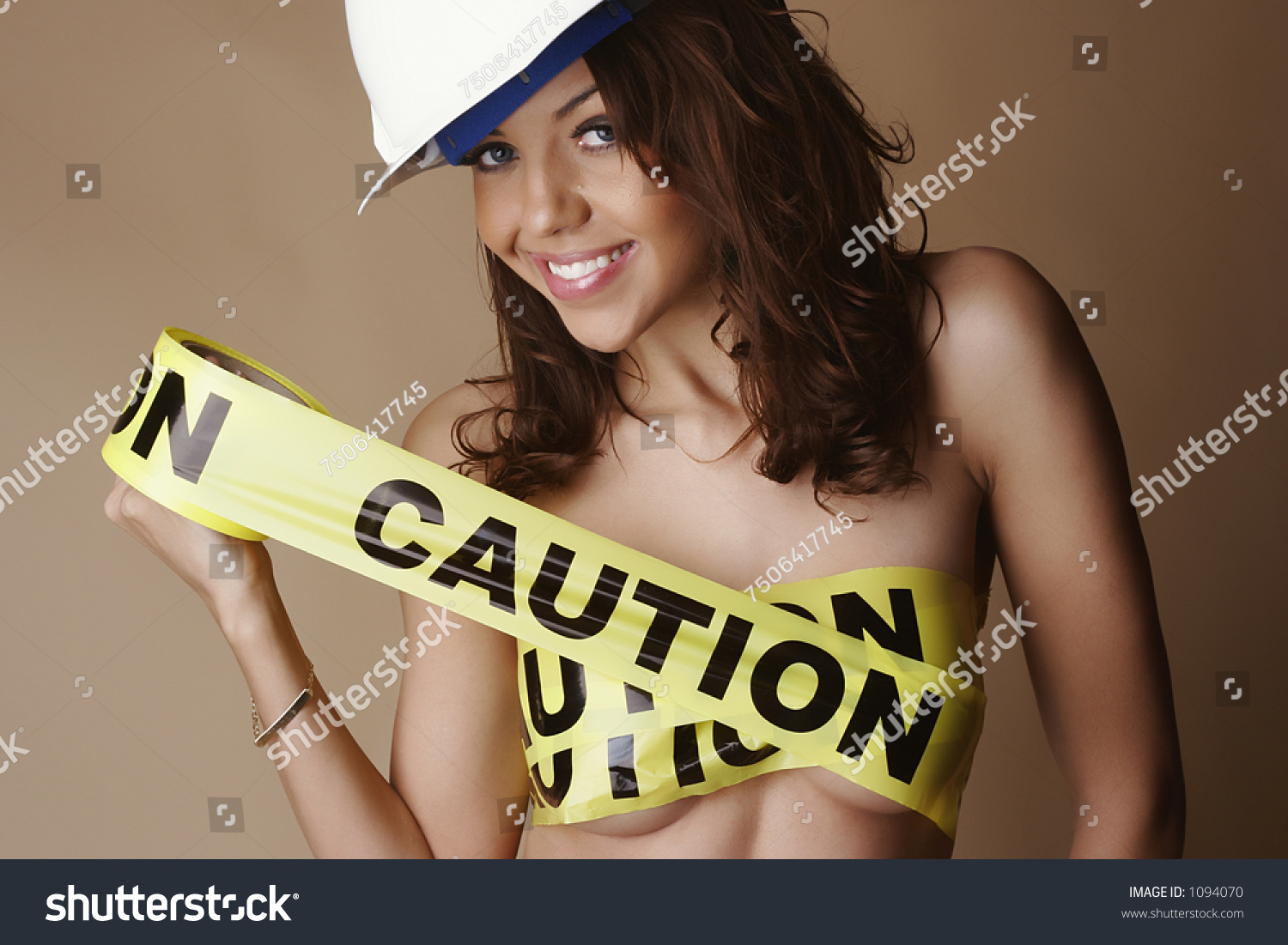 stock-photo-nude-female-smiling-wearing-a-construction-hard-hat-and-with-breasts-covered-by-yellow-caution-1094070.jpg