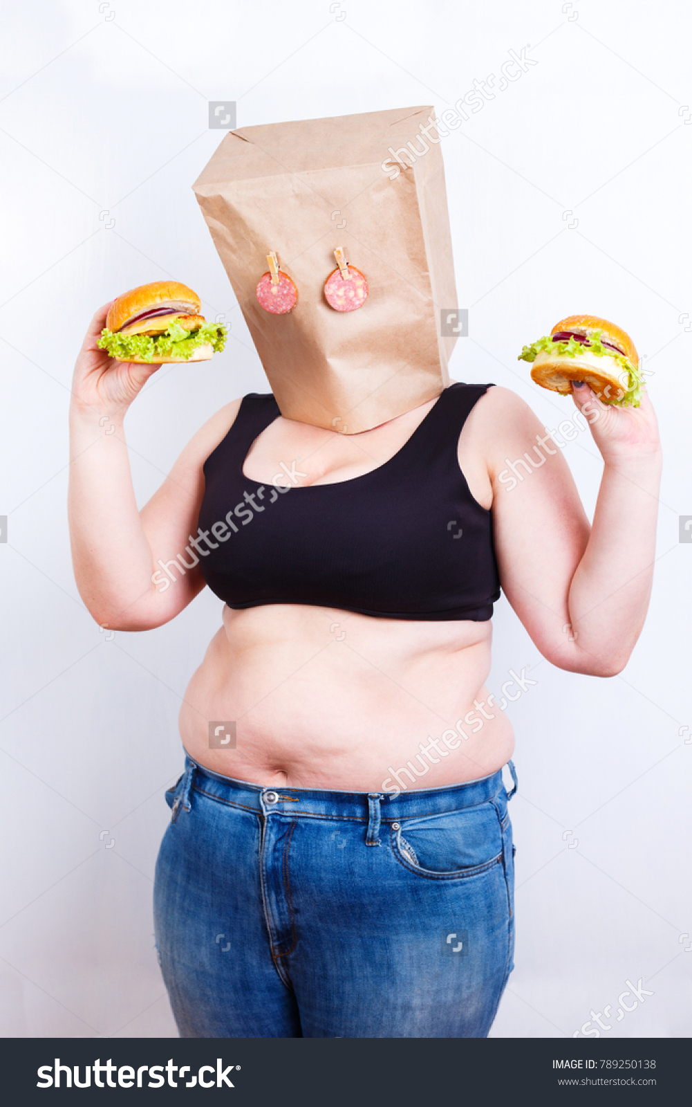 stock-photo-obese-fat-woman-with-a-paper-bag-on-head-like-a-mask-with-eyes-made-of-salami-as-a-symbol-of-food-789250138.jpg