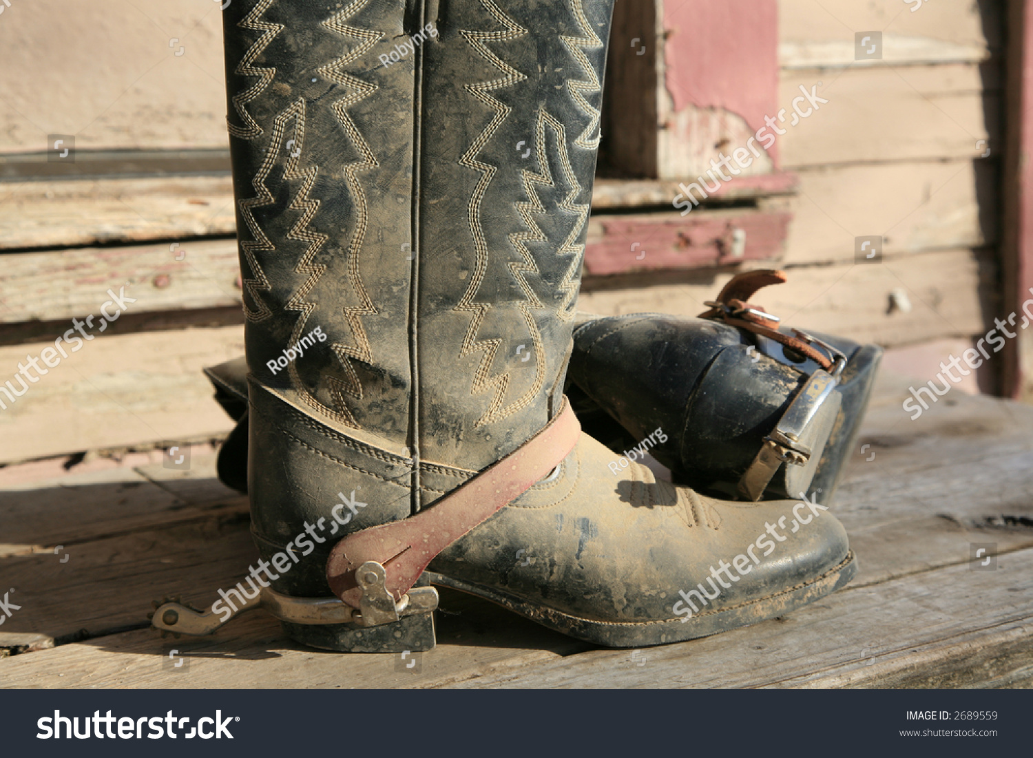 Old Dirty Cowboy Boots With Spurs On Rustic Front Porch Stock Photo ...