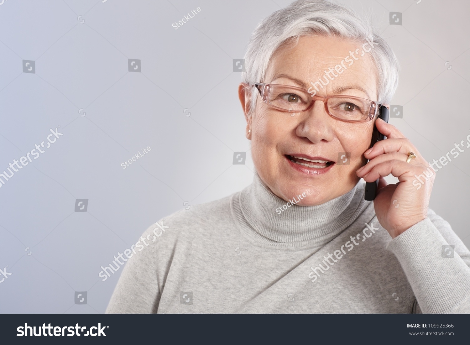 Old Lady Talking On Mobile Phone, Smiling, Looking Away. Stock Photo ...