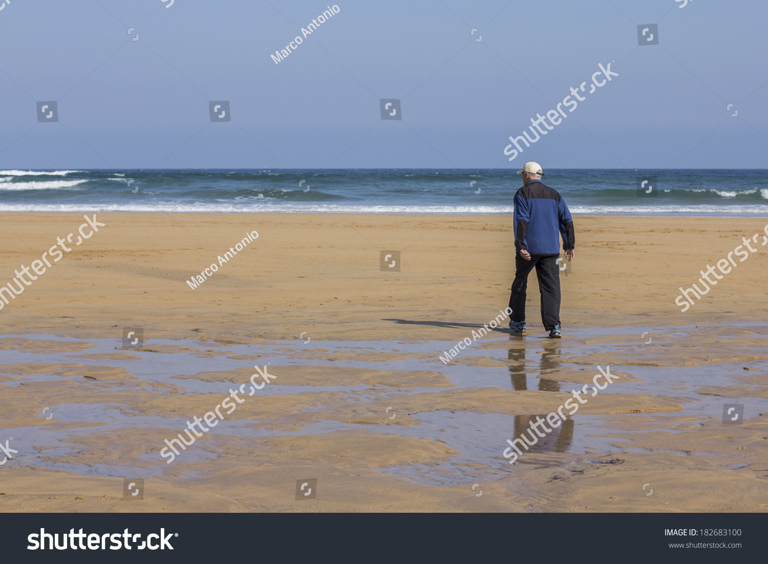 Old Man Walking On Beach Stock Photo 182683100 - Shutterstock