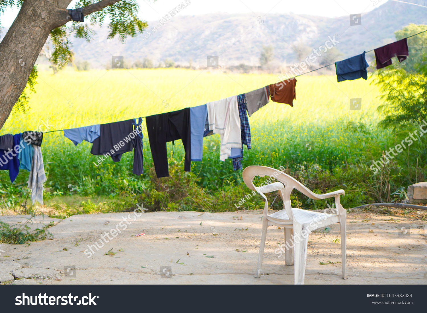 Old Plastic Chair Clothes Line Yellow Stock Photo Edit Now 1643982484