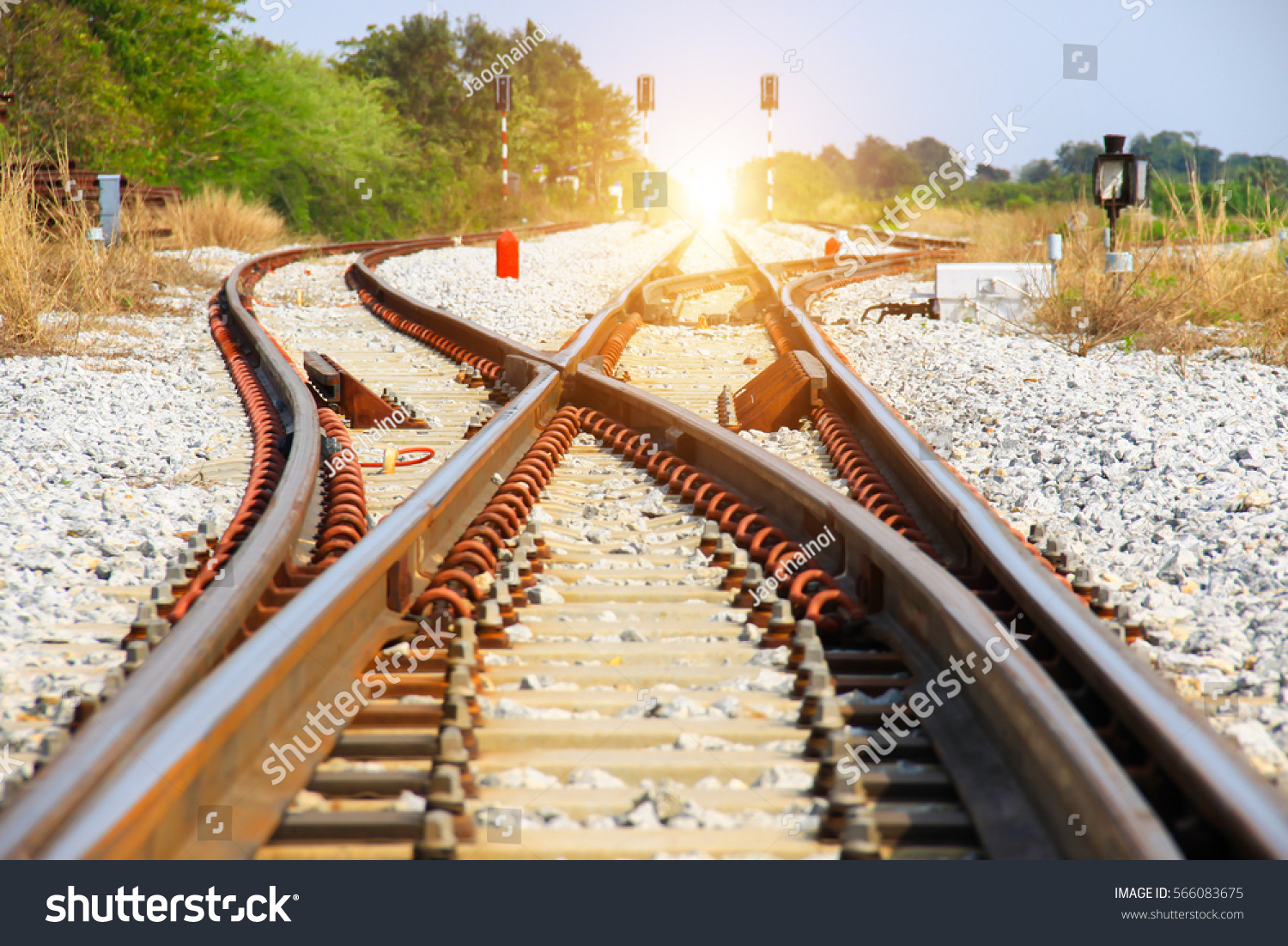 Old Railroad Tracks at a Junction on a Sunny Day (change, direction)