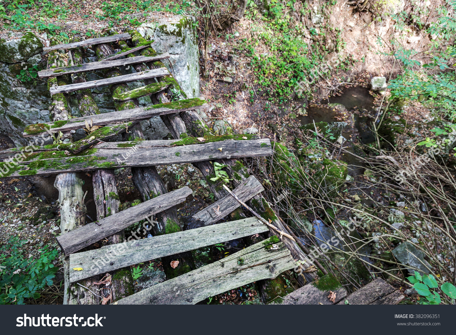 stock-photo-old-ruined-wooden-foot-bridg