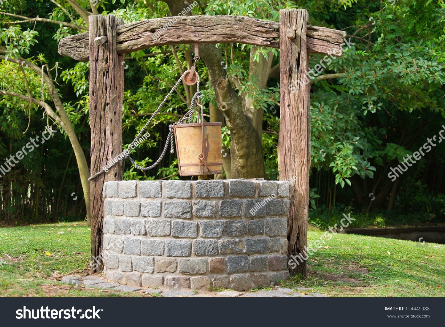 stock-photo-old-water-well-with-pulley-and-bucket-124449988.jpg