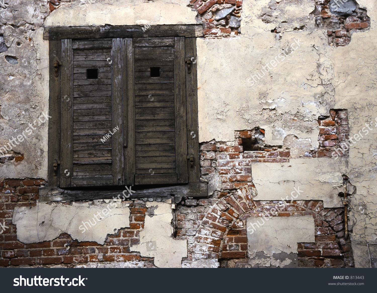 Old Weathered Wooden Shutters Covering Window In Red Brick Wall; Wall ...