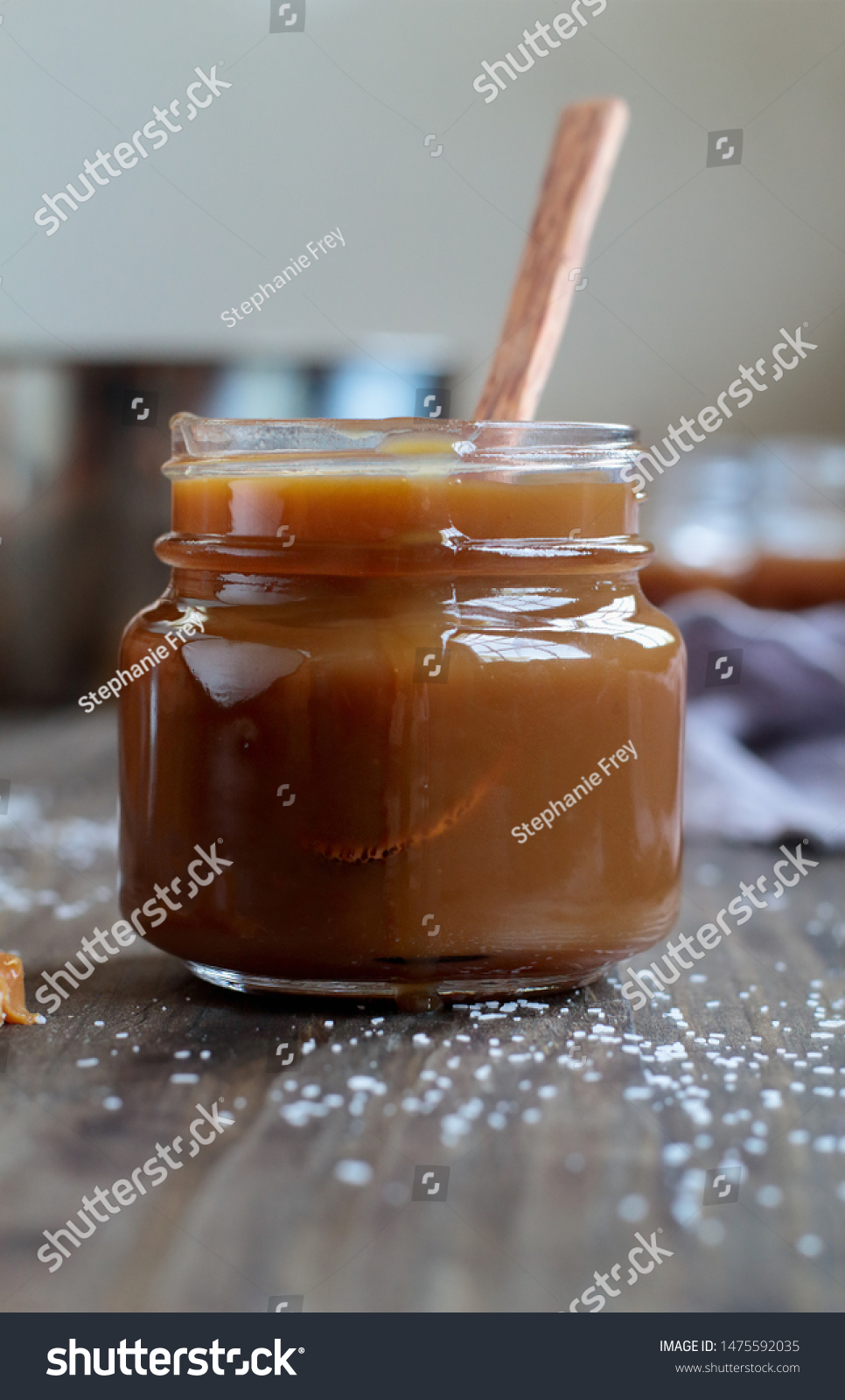 202 Carmel Sauce Images Stock Photos Vectors Shutterstock   Stock Photo Open Jar Of Salted Caramel Sauce Over A Rustic Table Selective Focus With Blurred Background 1475592035 