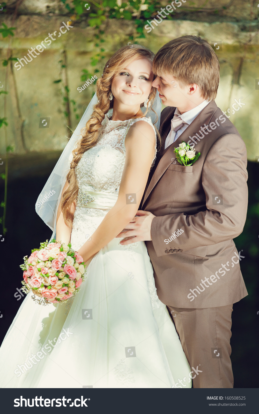 Outdoors Portrait Of Beautiful Young Bride And Groom Over Old Bridge On ...