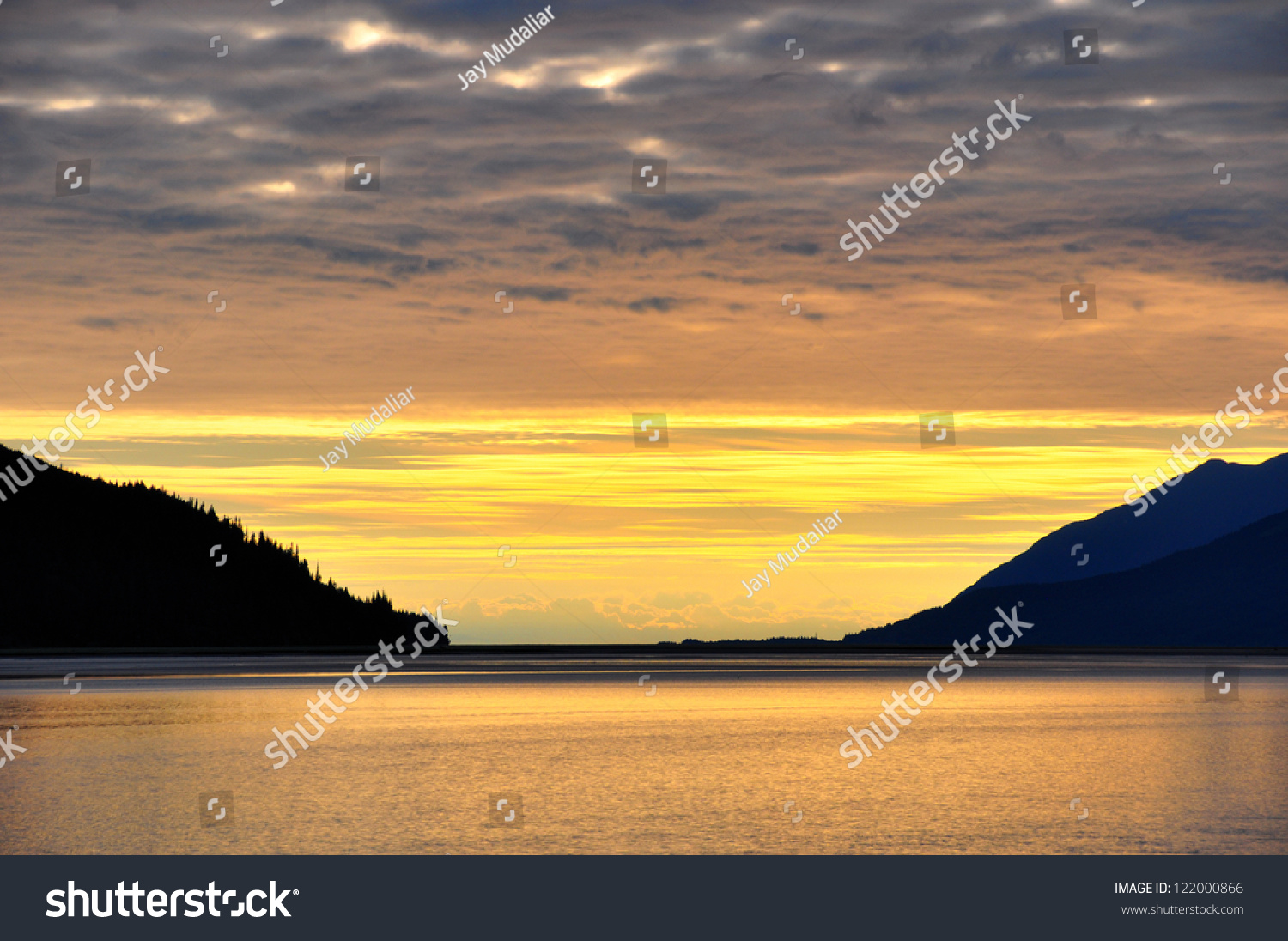 Overcast Sky With Golden Sunset At Turnagain Arm, Alaska. Stock Photo ...