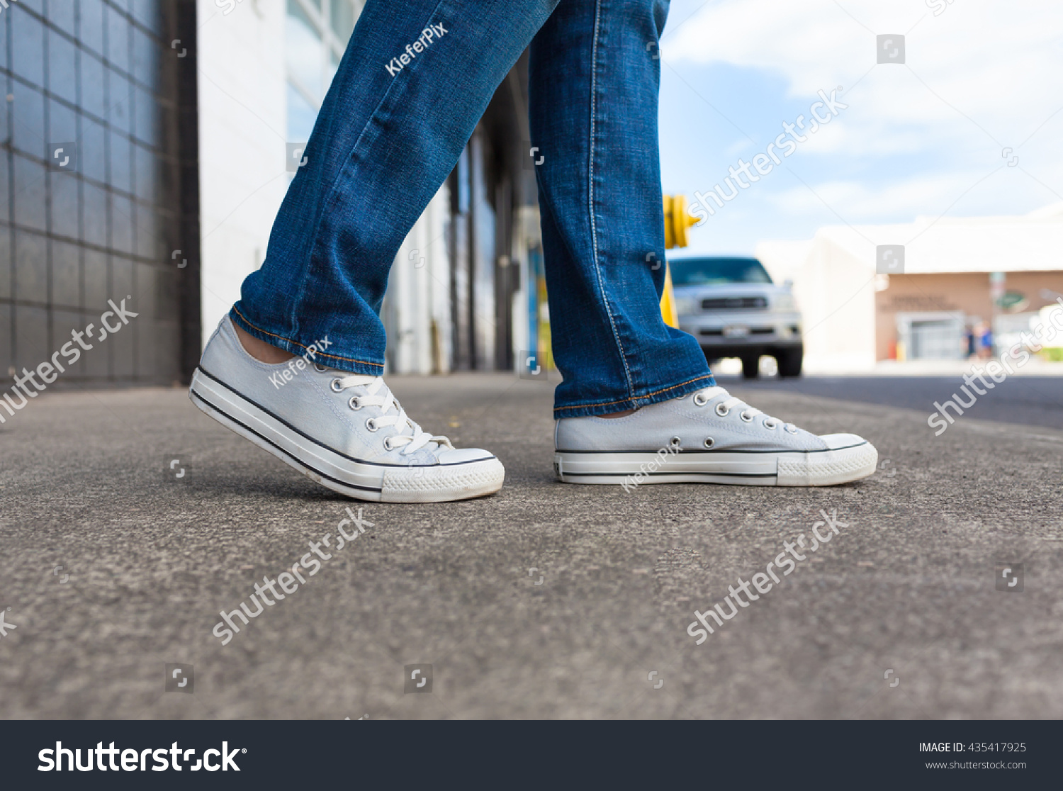 Pair Of Feet Walking On A City Street. Stock Photo 435417925 : Shutterstock