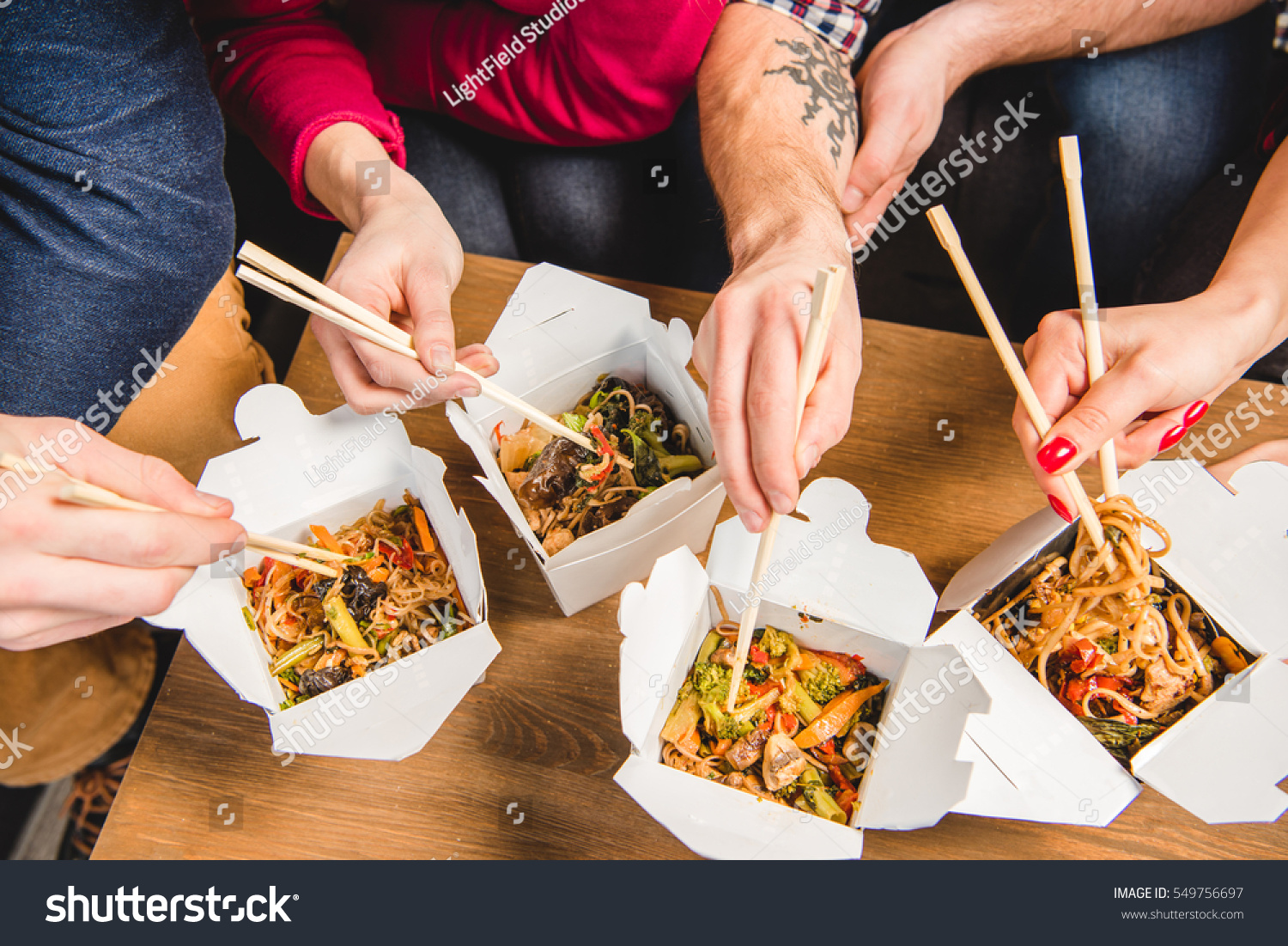 people eating with chopsticks