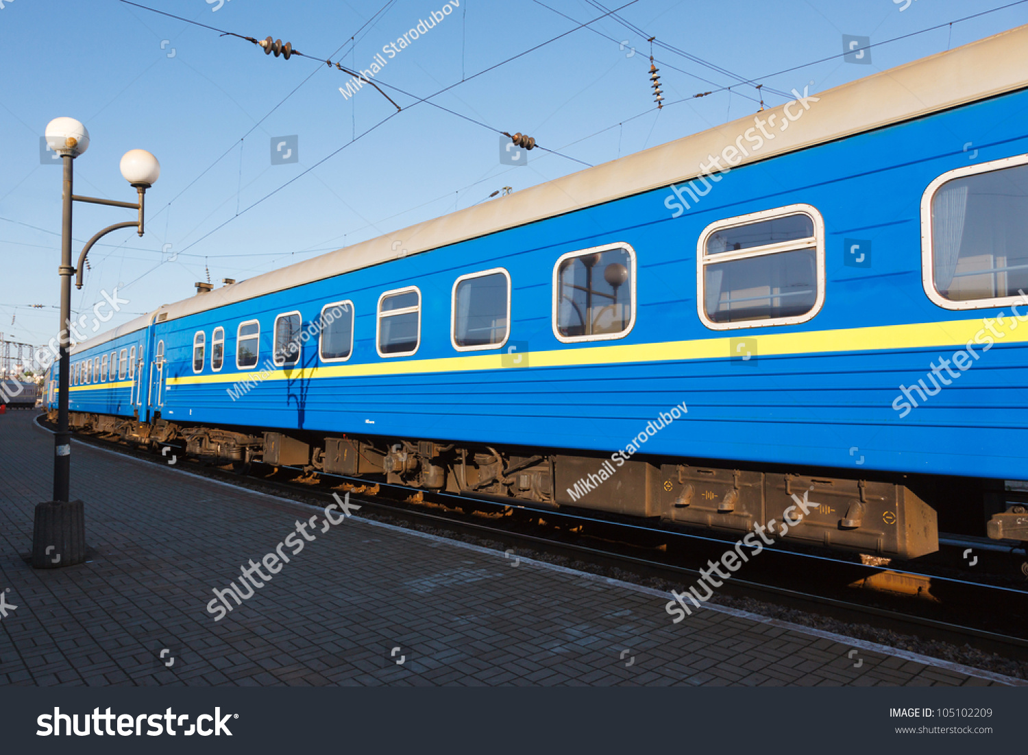 Passenger Rail Car Blue Color On Empty Platform In Early Morning Stock ...